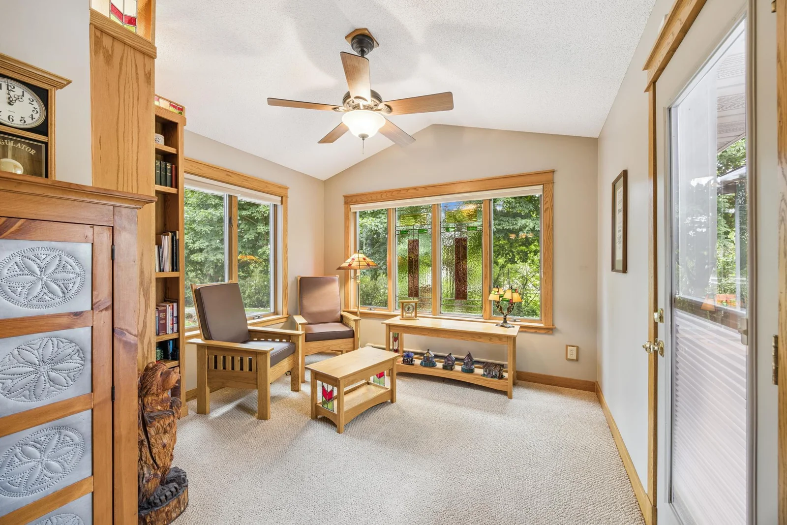 Peaceful sunroom with a built-in bookshelf