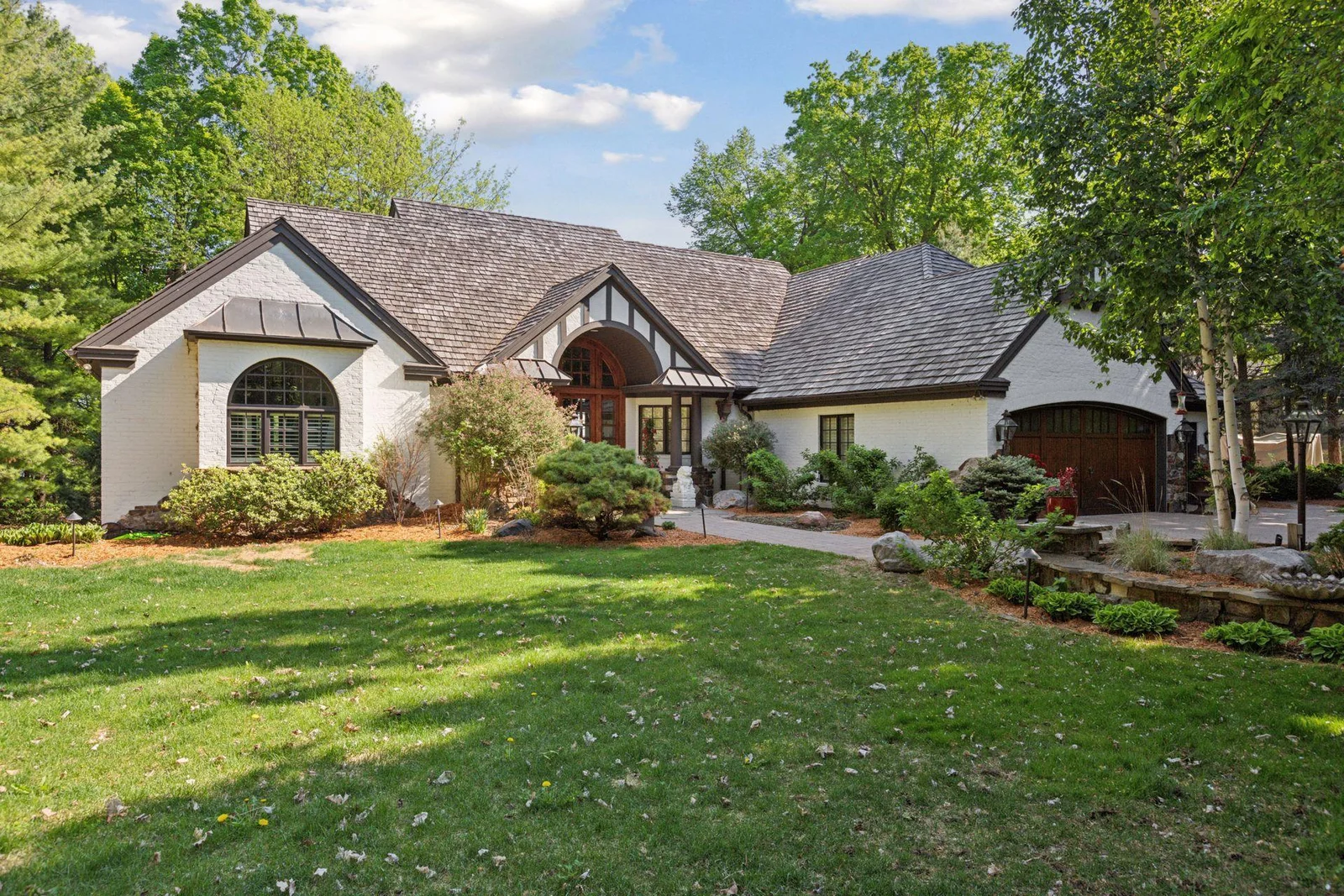 The epitome of craftsmanship and beauty with just under two acres of privacy and exquisite sweeping views of Lake Minnetonka.