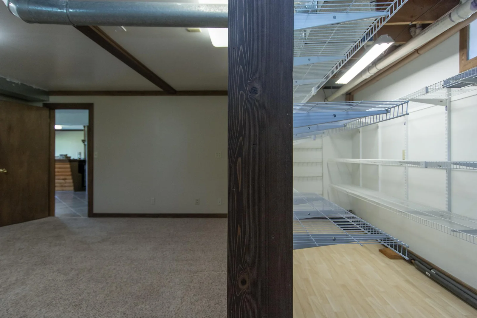 The bedroom has extra space to be used for a closet or extra storage.