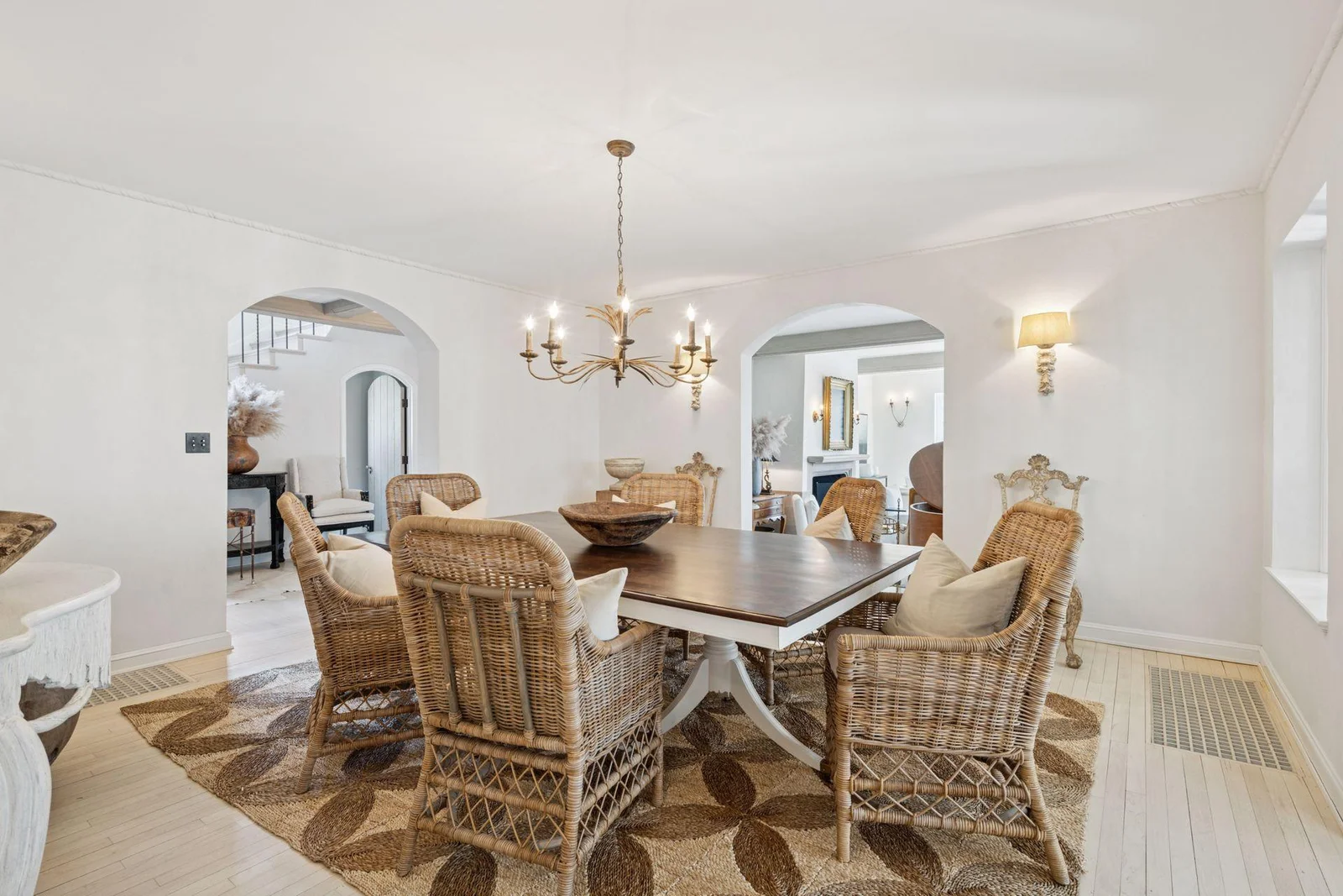 Arched doorways from the main hall and living room lead to the spacious dining room.