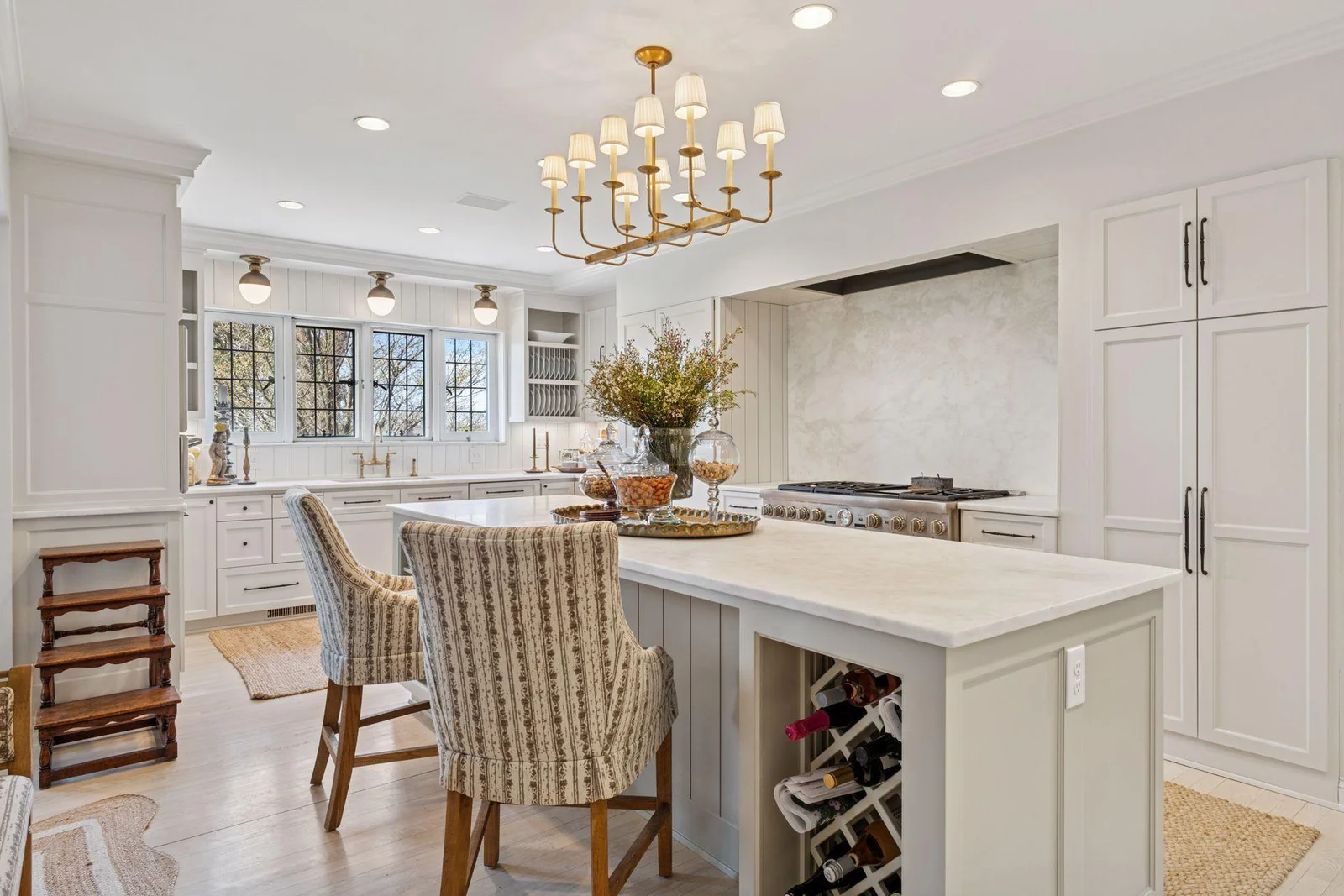 Large center island, integrated appliances, double oven range and exhaust hood, lovely leaded glass windows overlook the yard with seasonal views of the lake. Rare marble countertops.  Excellent counterspace and storage.