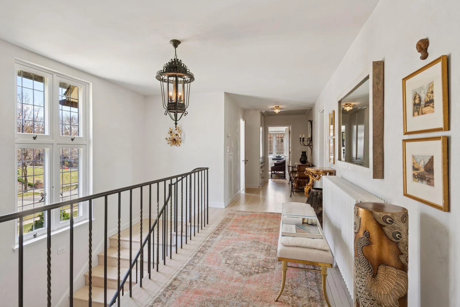 The upper hall leads to secondary bedroom suites and a full hall bath.  An adjacent bedroom wing leads to the fourth and fifth bedrooms and an additional full hall bath. Five bedrooms and four bathrooms on this level.