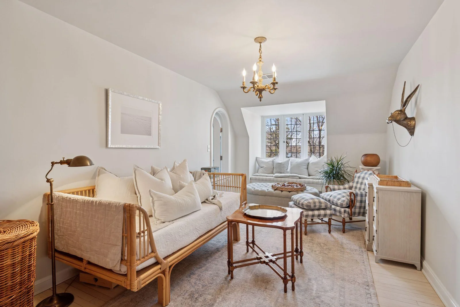 Charming second bedroom suite with inviting built-in window seat overlooking gardens, sunsets, and seasonal lake views.  Walk-in closet and full bath.
