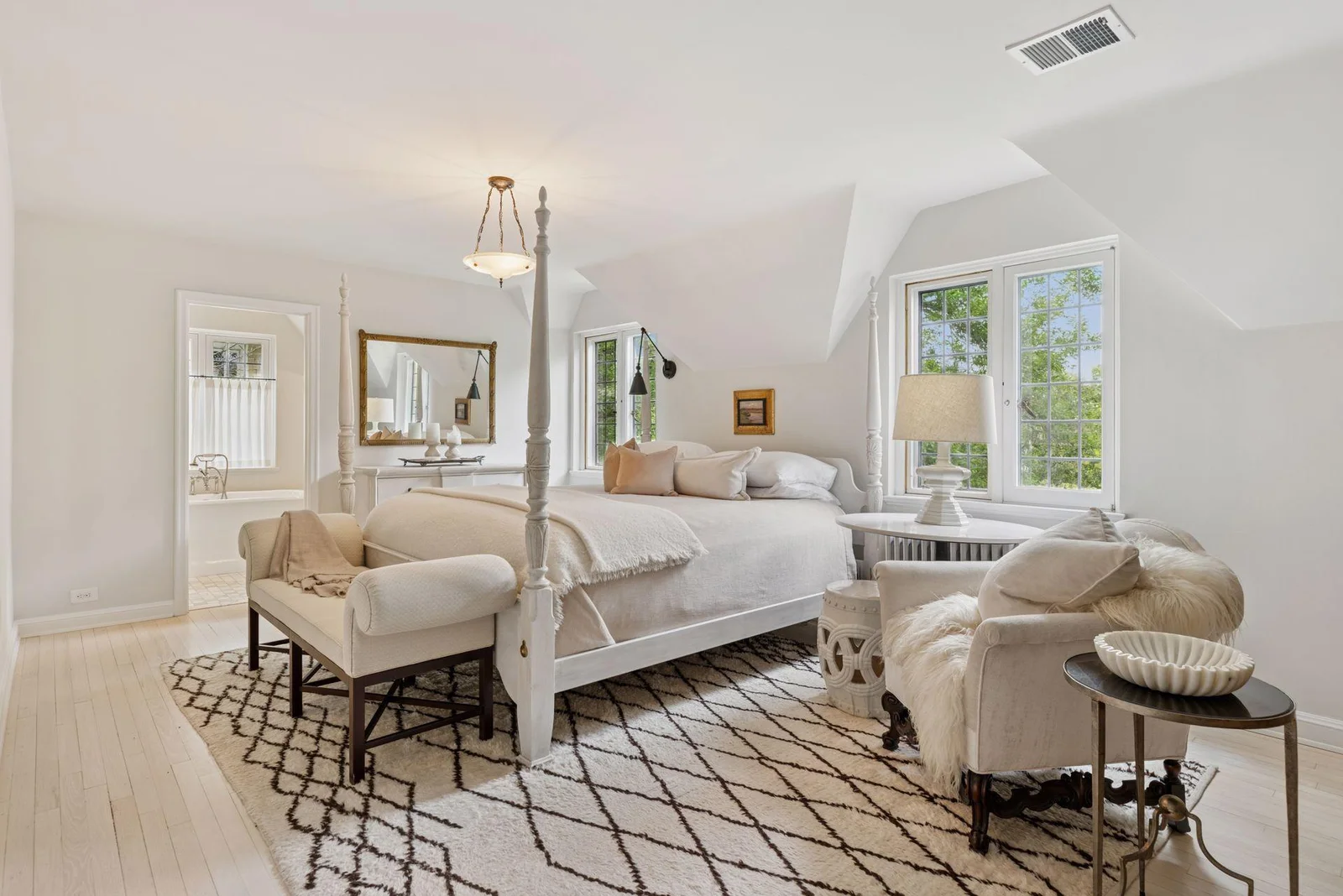 Serene primary suite with two walk-in closets and beautiful marble bath. Pretty garden views and seasonal views of Lake Harriet. Southern and western exposure.
