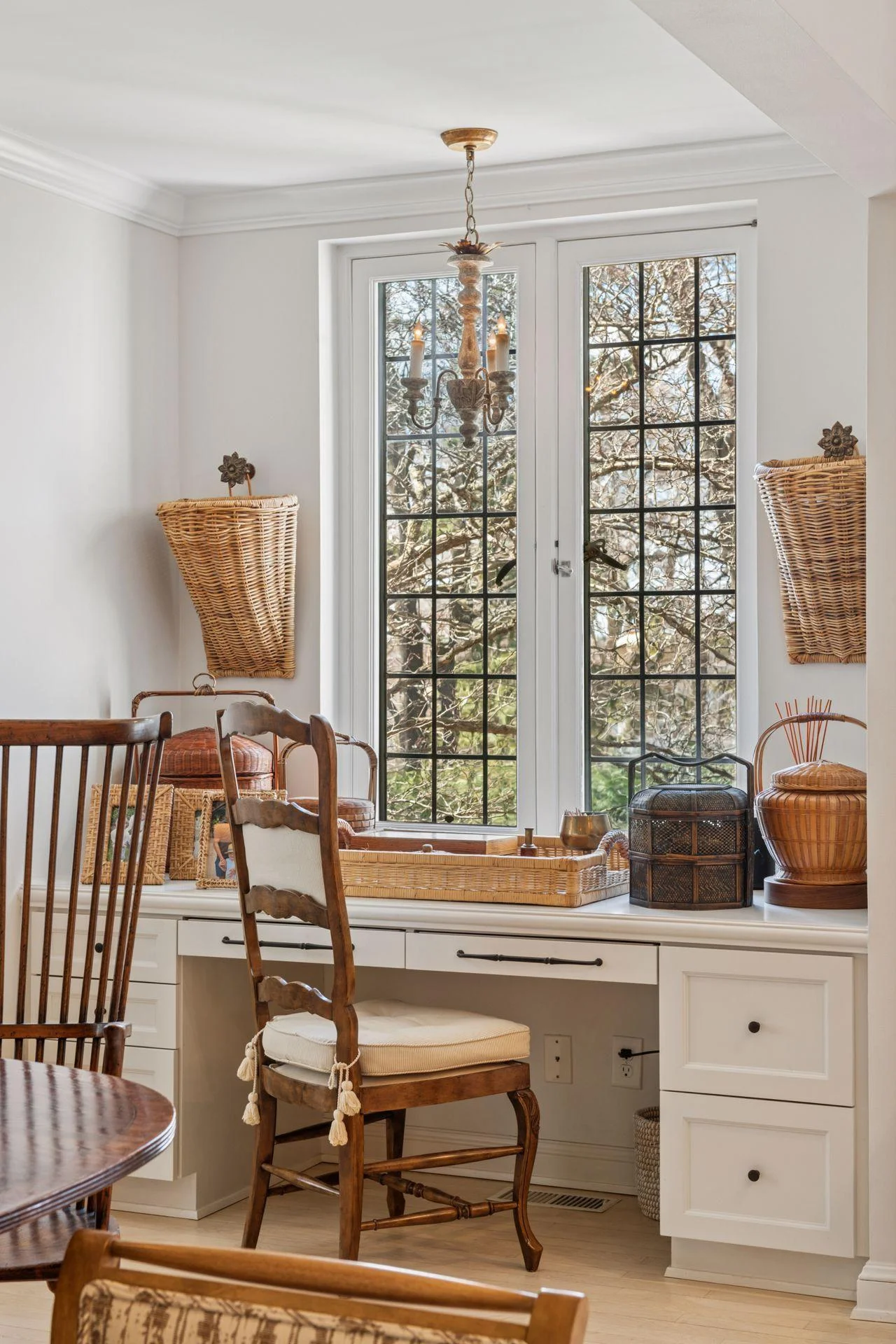 Built-in desk area located in kitchen with pretty garden views through leaded glass windows.