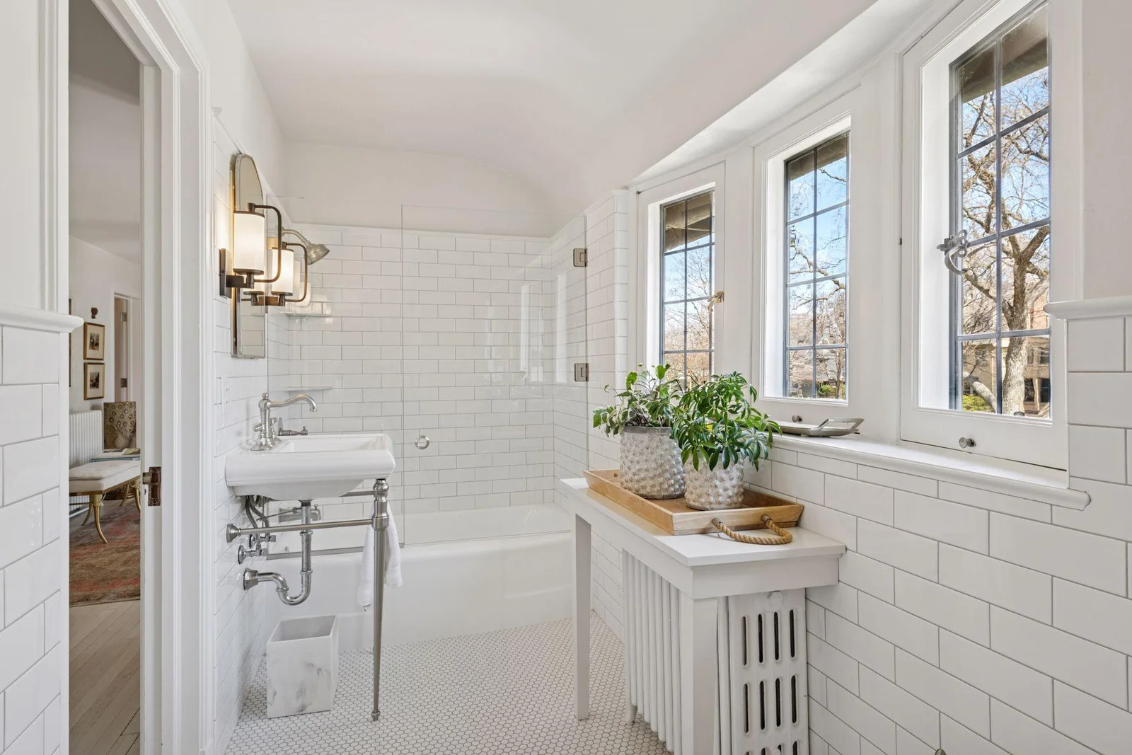 Full hall bath off upper hallway is also en suite with the 3rd bedroom.