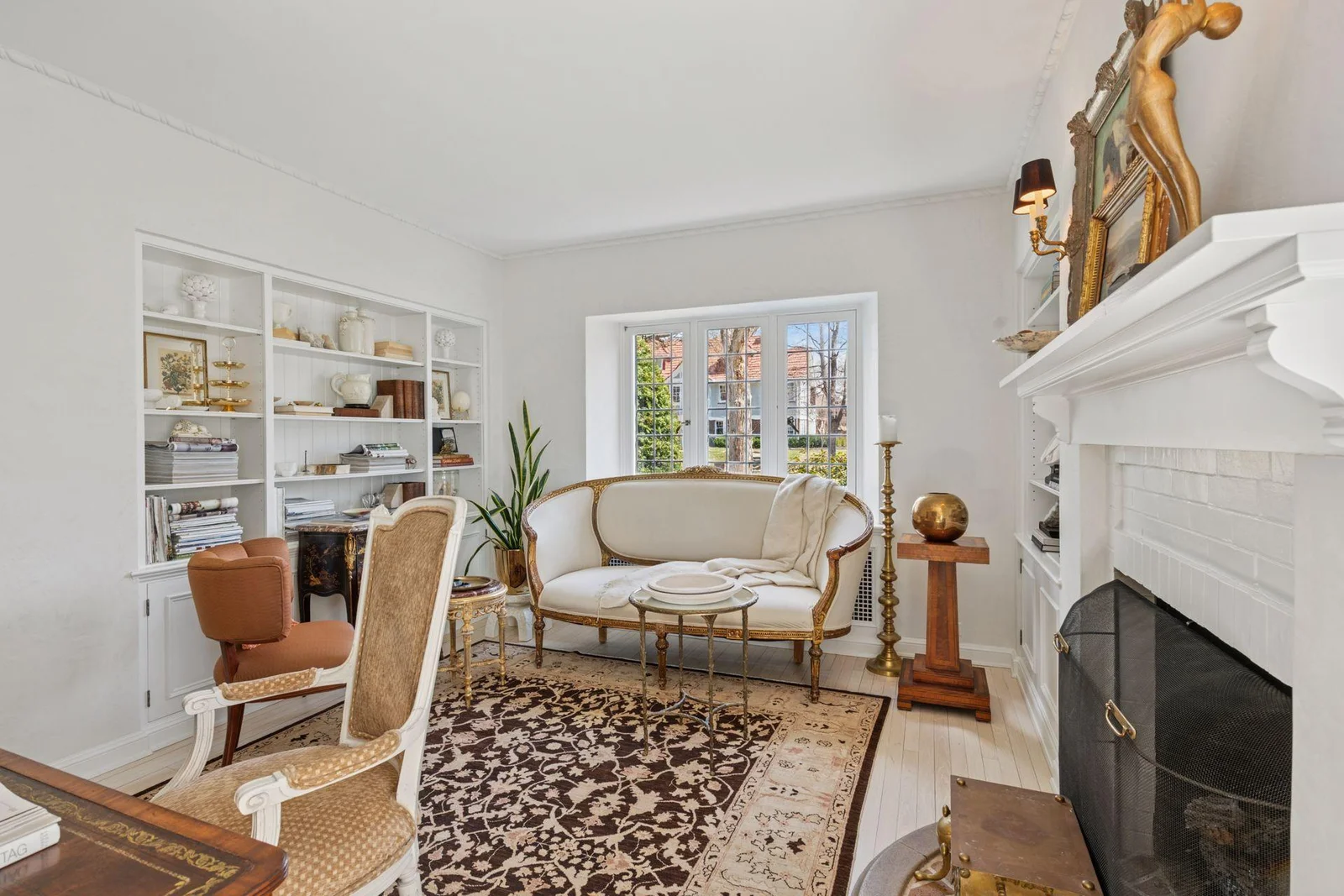 Main level den/office.  Gas log-set fireplace.  Built-in library shelving and cabinetry.