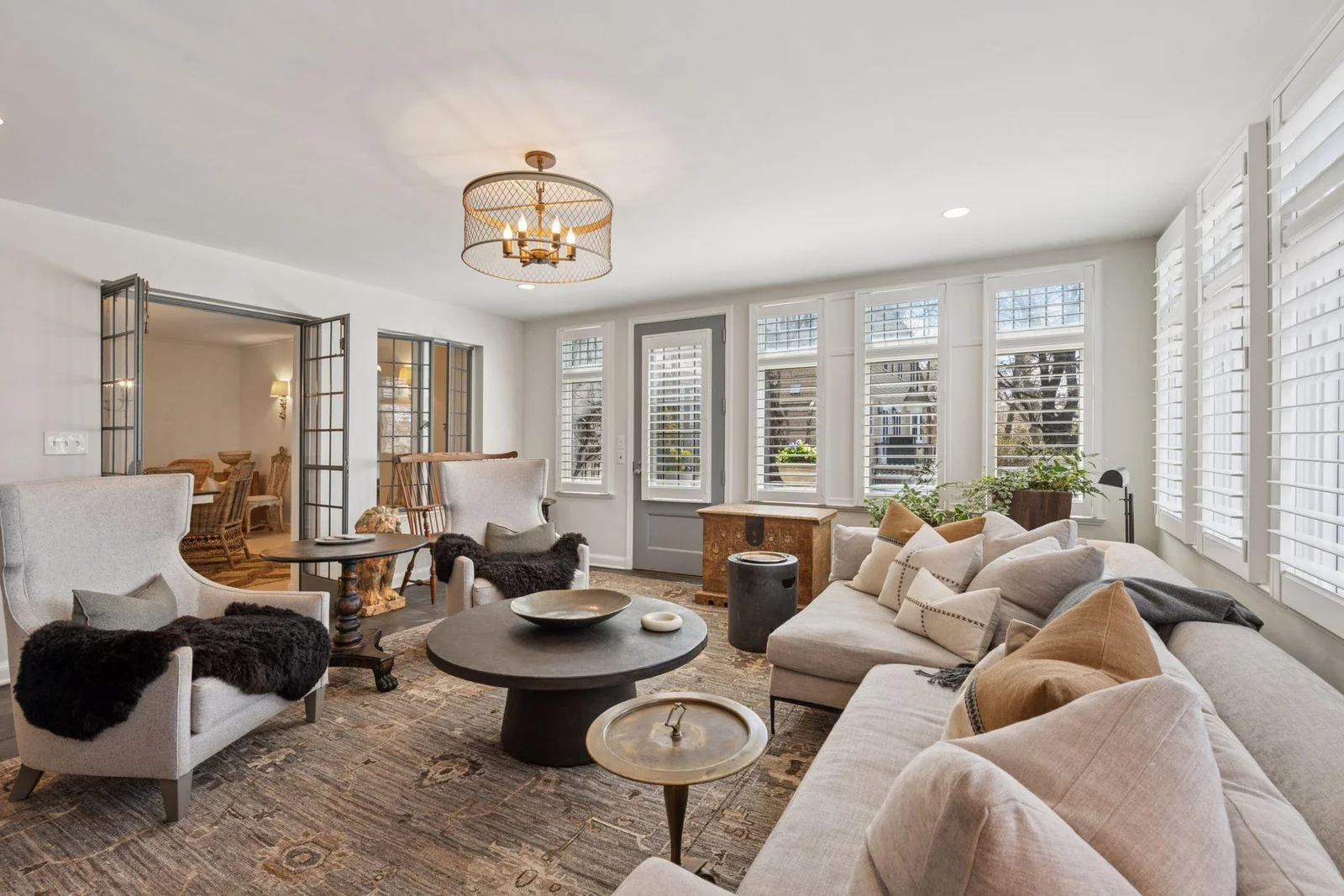 Light-filled main level family room with direct access to the patio and outdoors. Southern and western exposure.
