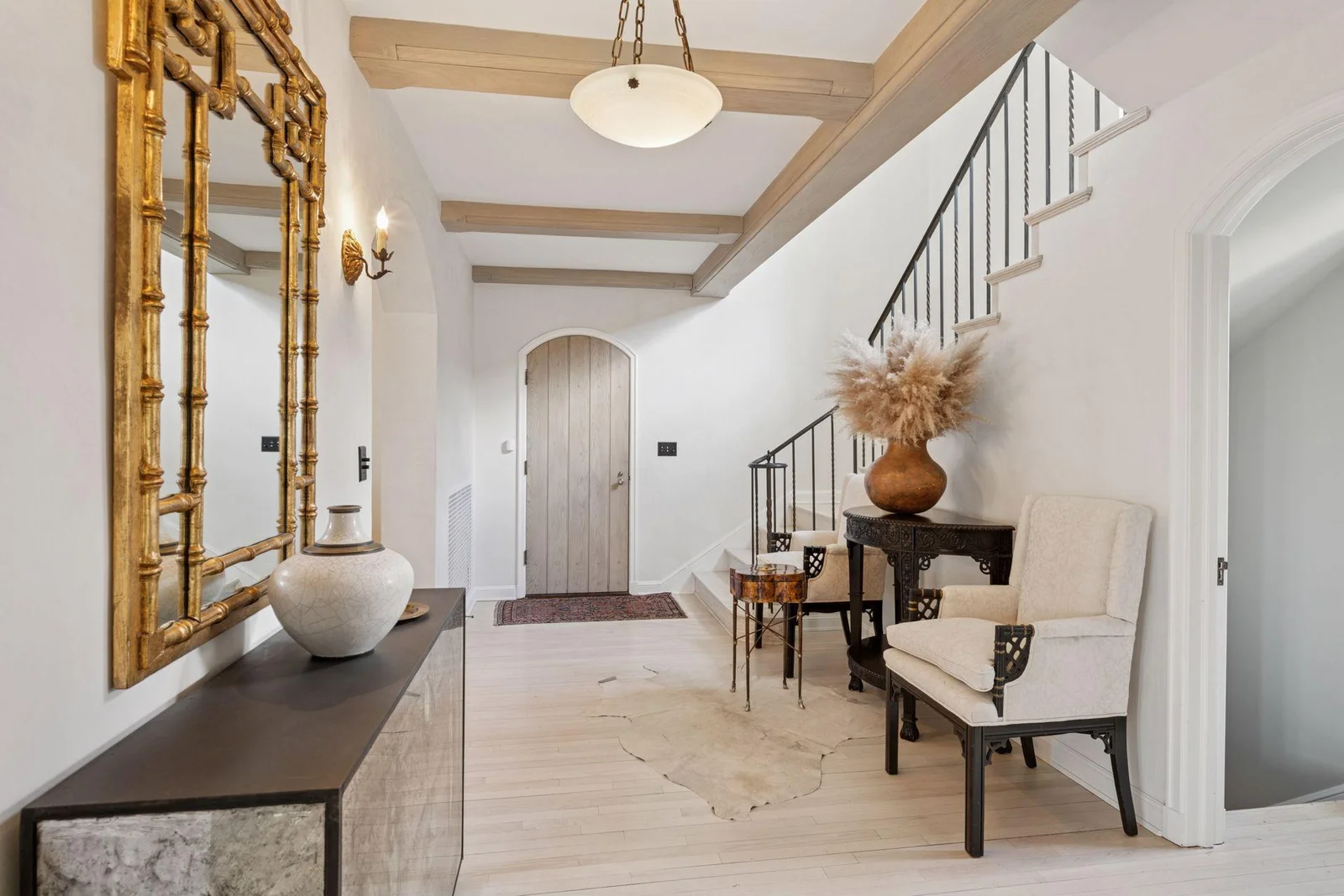Main entry hall. Hardwood floors and artisan plaster walls throughout.