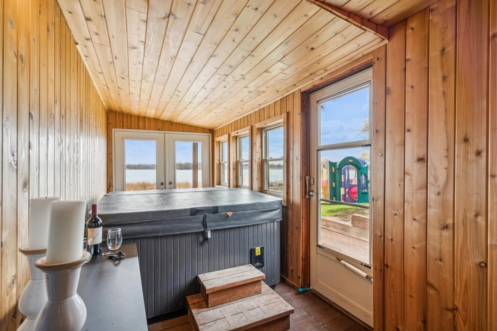 Lower level sun room with walk-out access to the patio