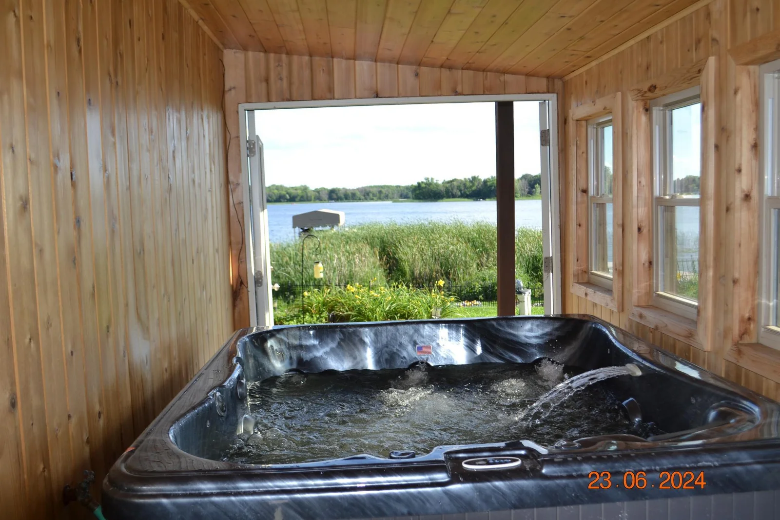 Relaxing hot tub overlooking serene Ham Lake