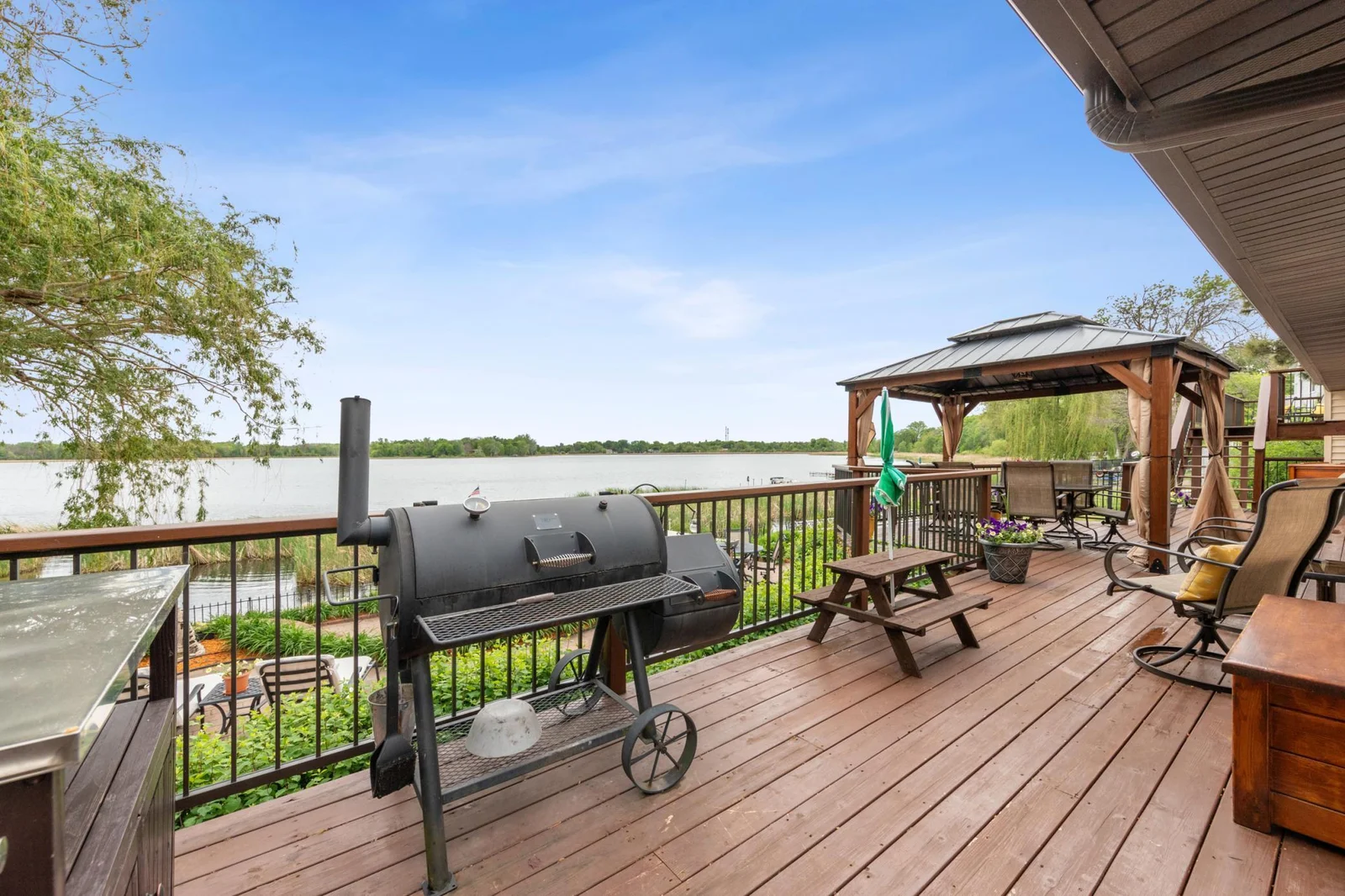 Entertaining deck and patio that leads onto the expansive dock perfect for summer water activites