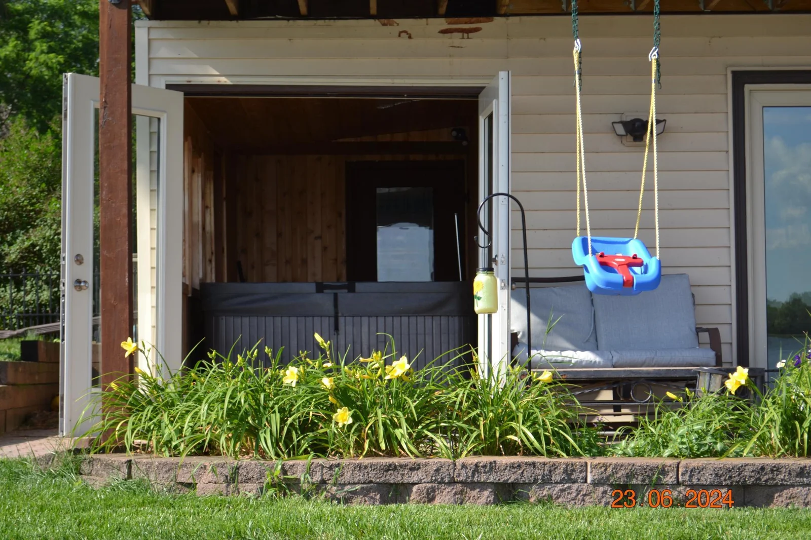 Perennial garden beds and hot tub access perfect for unwinding  after a day on the lake