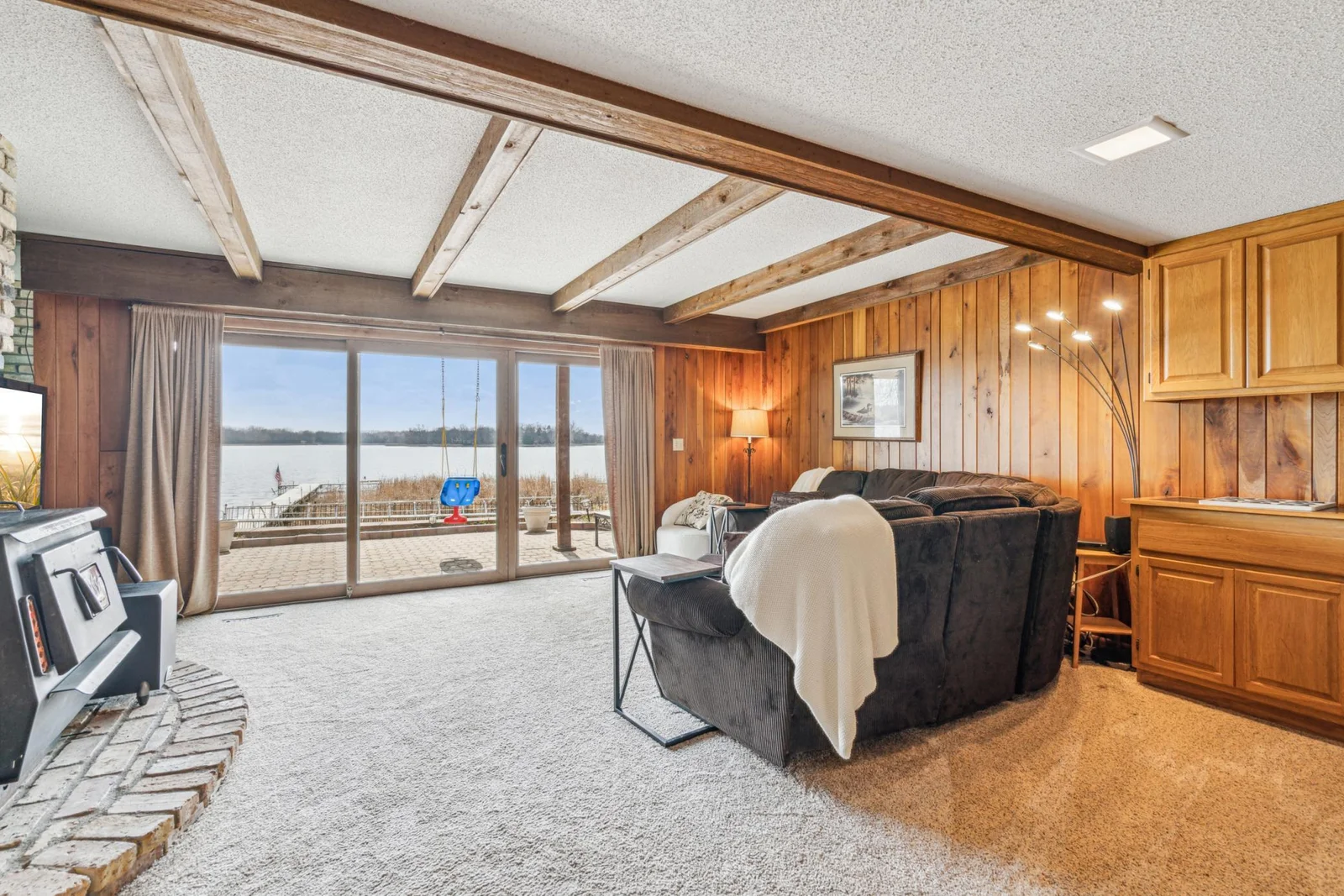 Lower level family room with walk-out access to the expansive patio