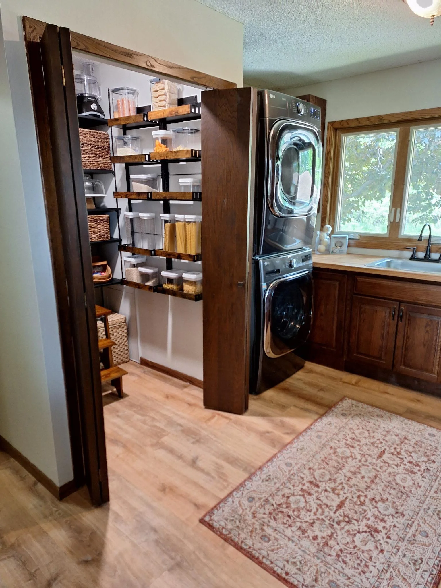 Spacious laundry area with a large walk-in pantry