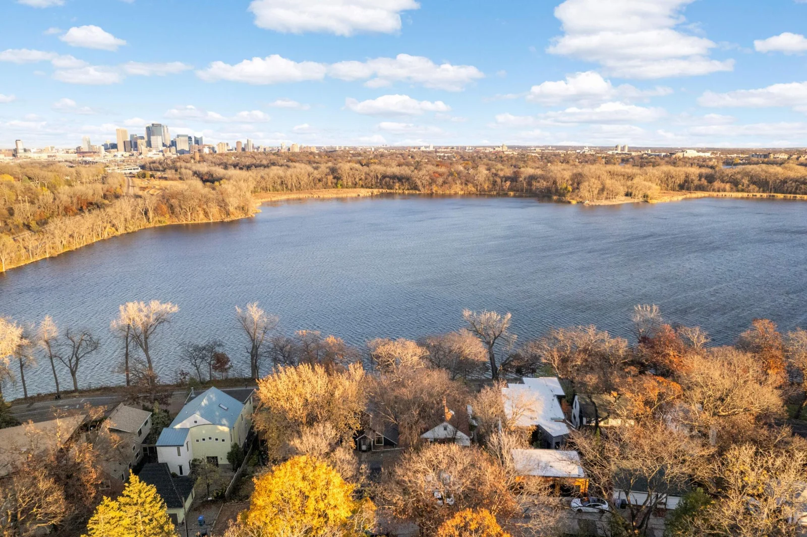 Tucked into a quiet, tree-lined parkway—experience the charm and privacy of lakeside living