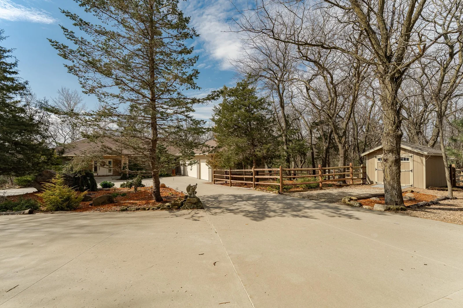 Concrete circle driveway and storage shed.
