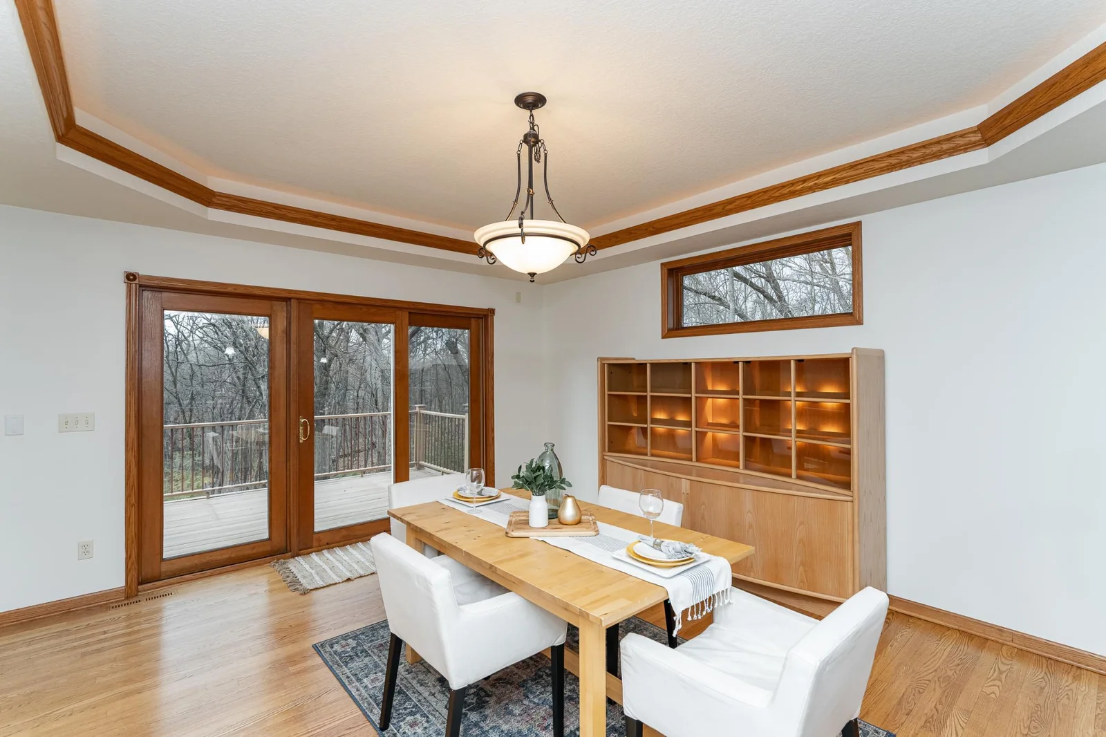 Large patio doors lead to deck and backyard.