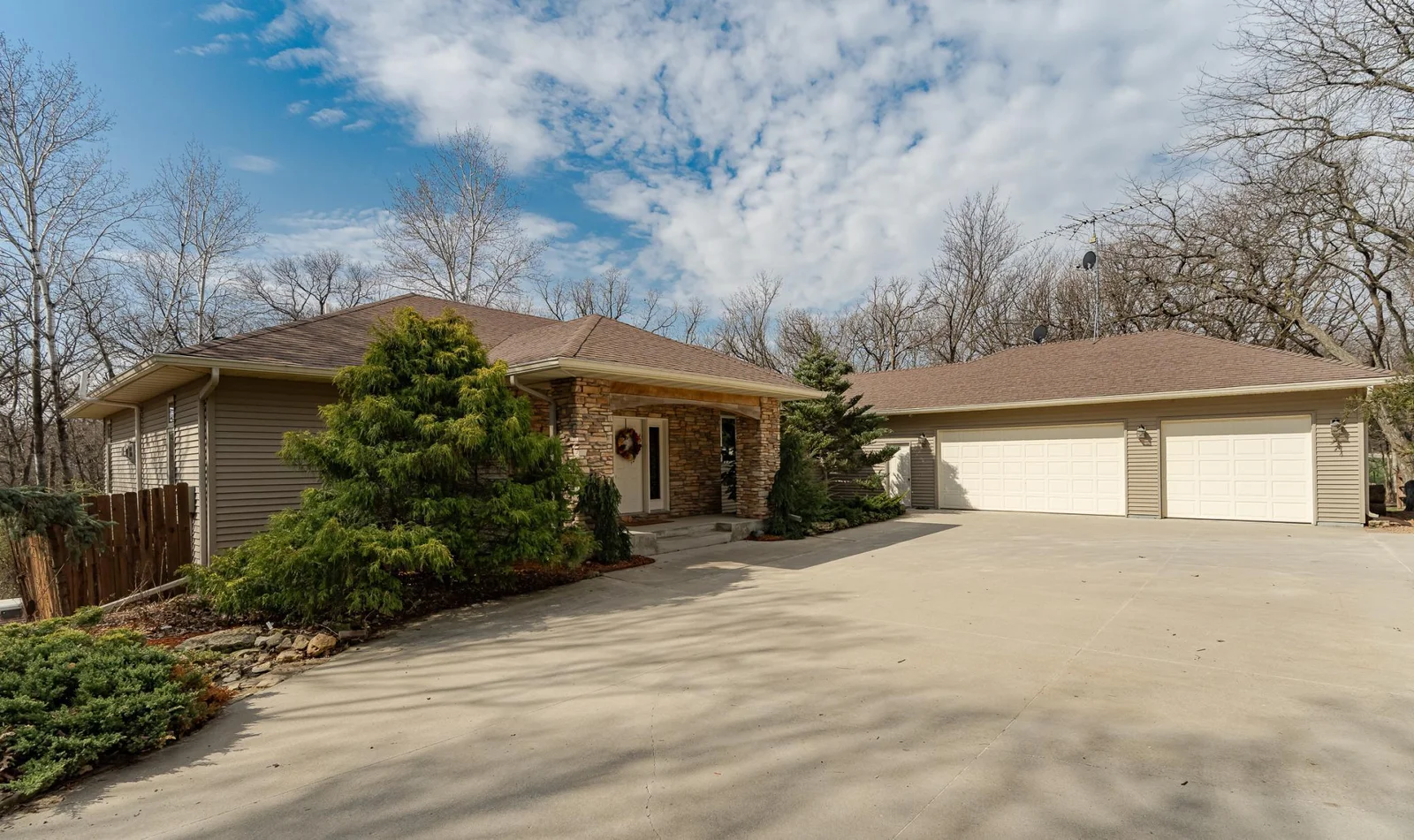 Oversized 3 car attached garage with drain and new garage heater.