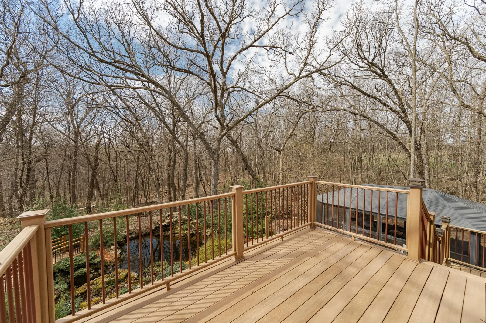 Enjoy this wooded setting from the deck!