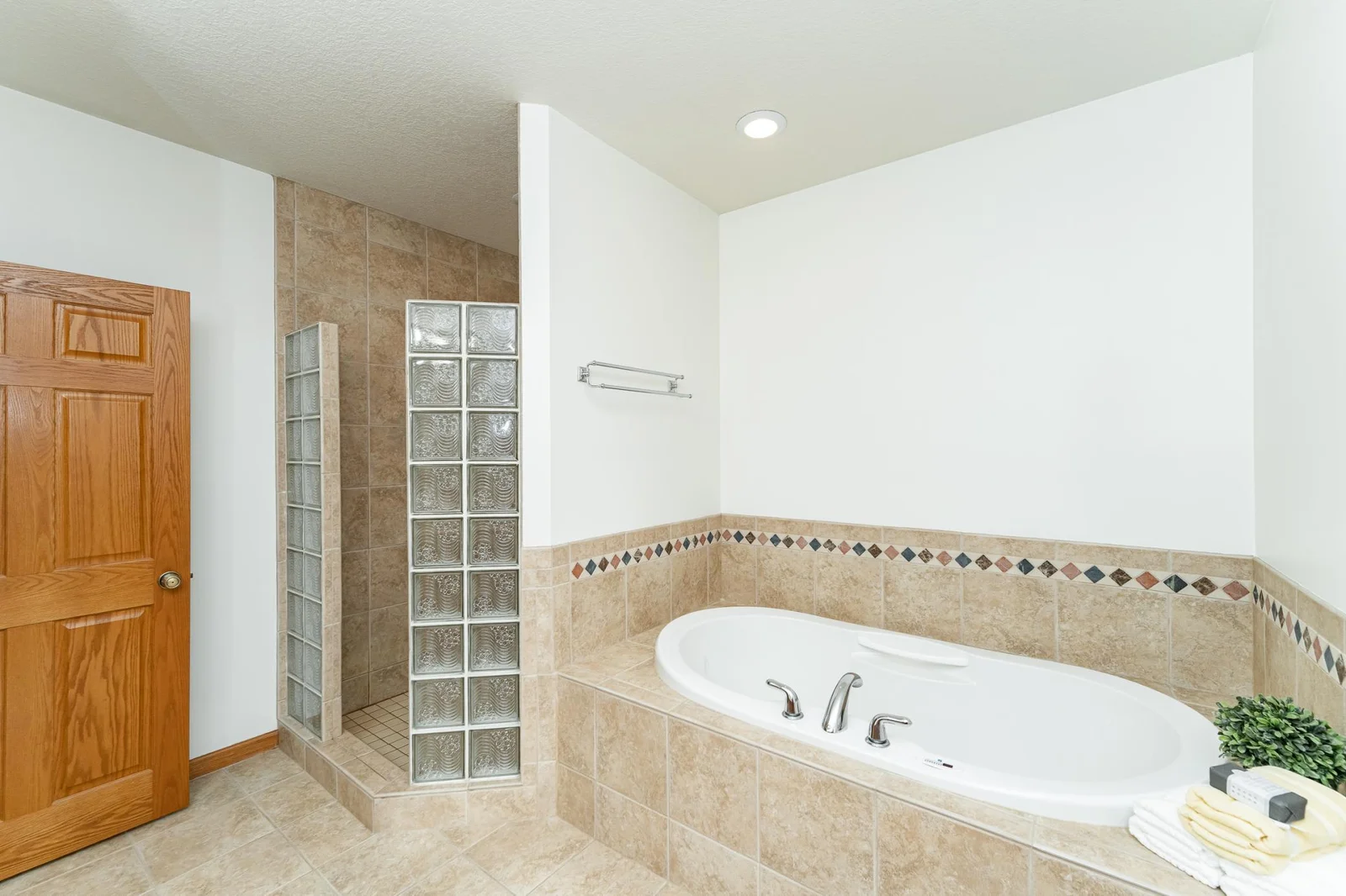 Tiled shower and soaker tub.