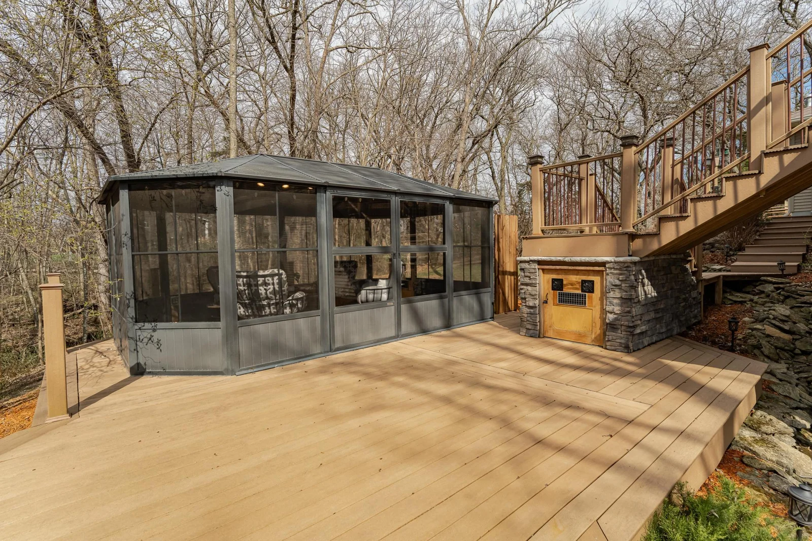Composite decking, solar lights, additional storage with solar powered ventilation under deck landing.