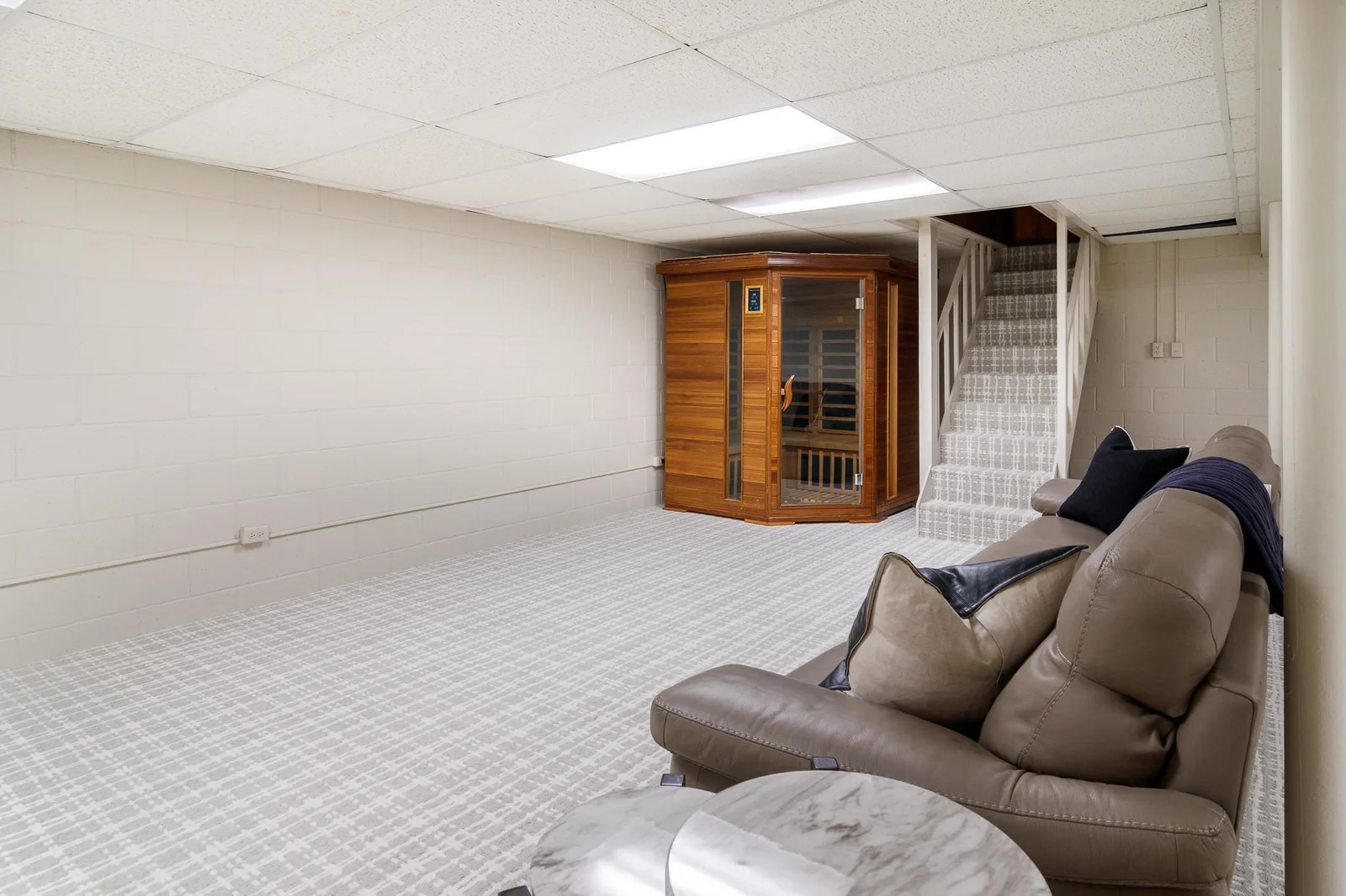 Lower level flex room, stairs to pool