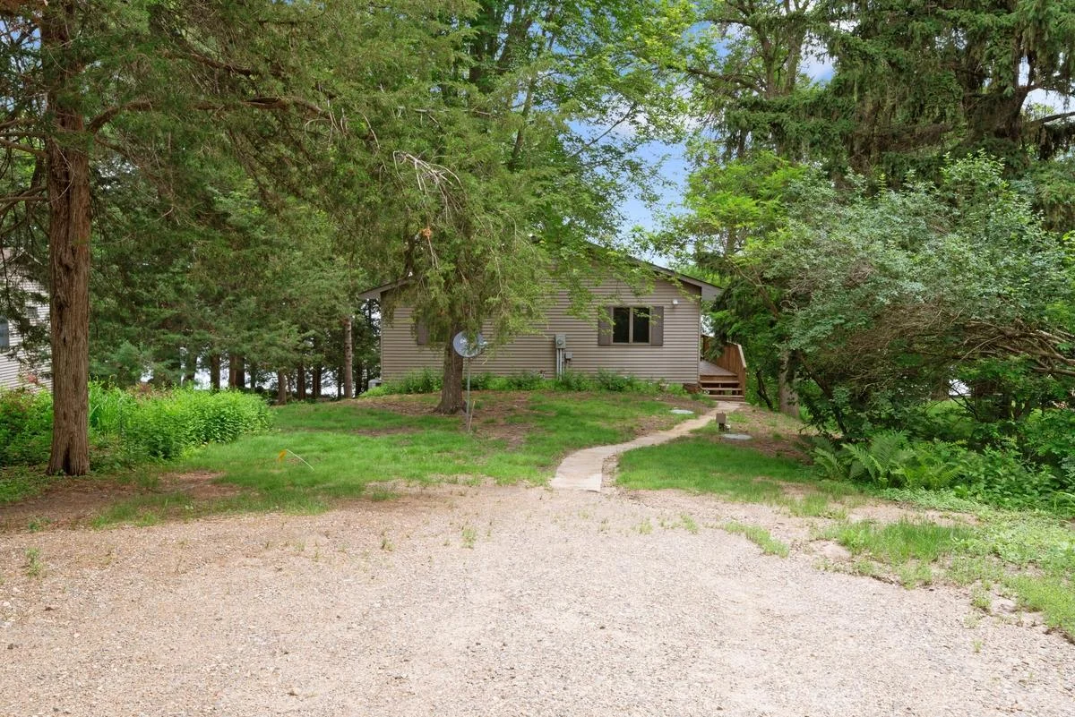 Located at the end of a dead-end road, the property features a spacious yard and ample parking, offering privacy and plenty of room for vehicles, trailers, and guests.