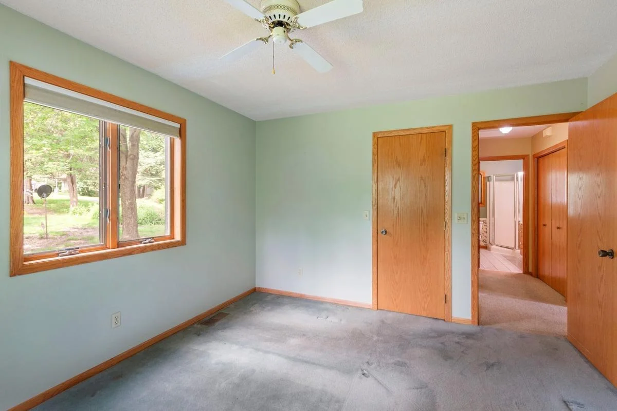 The primary bedroom offers a walk-in closet and is ideally situated just off the living room with easy access to the main bathroom.