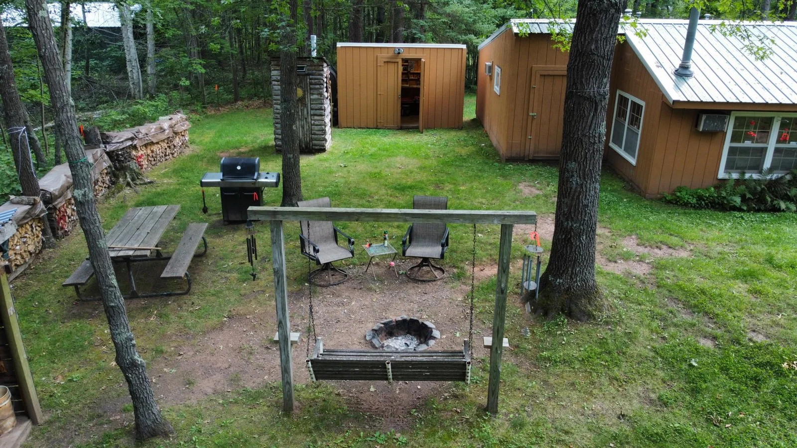Fire pit with swing