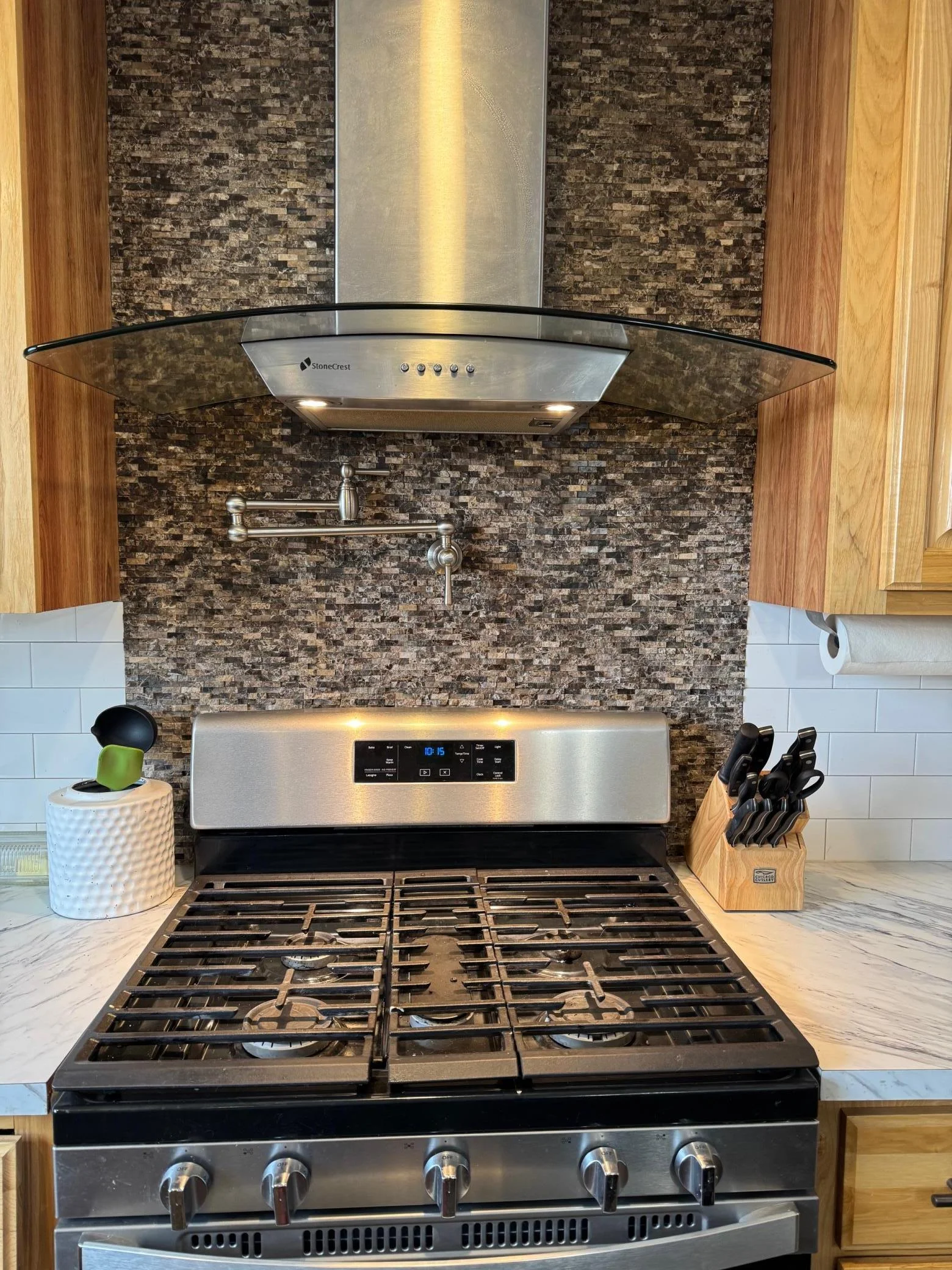 Fb.  Kitchen range with pot filler and range hood.jpg