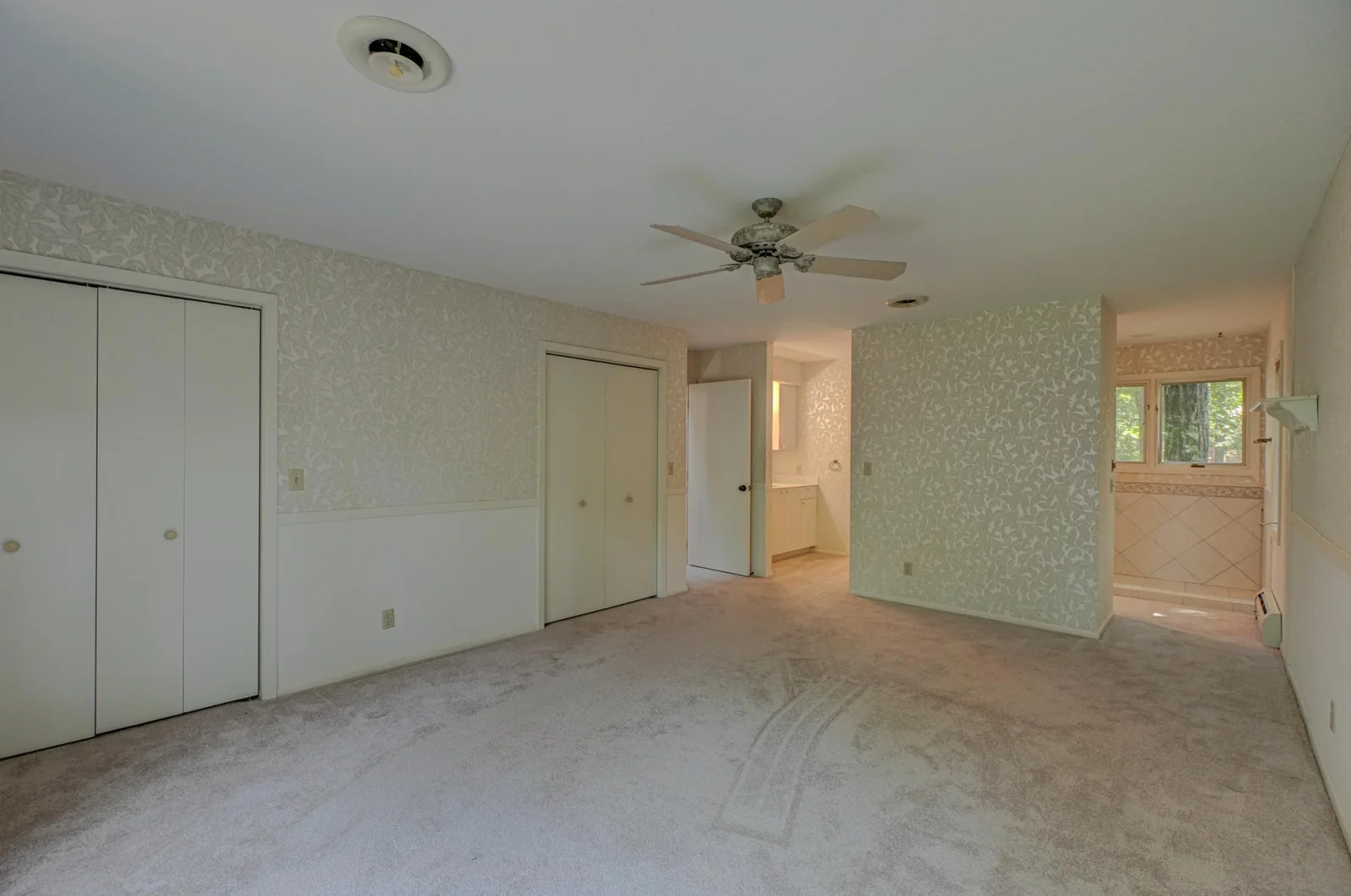 The primary suite features its own ensuite and panoramic vistas.