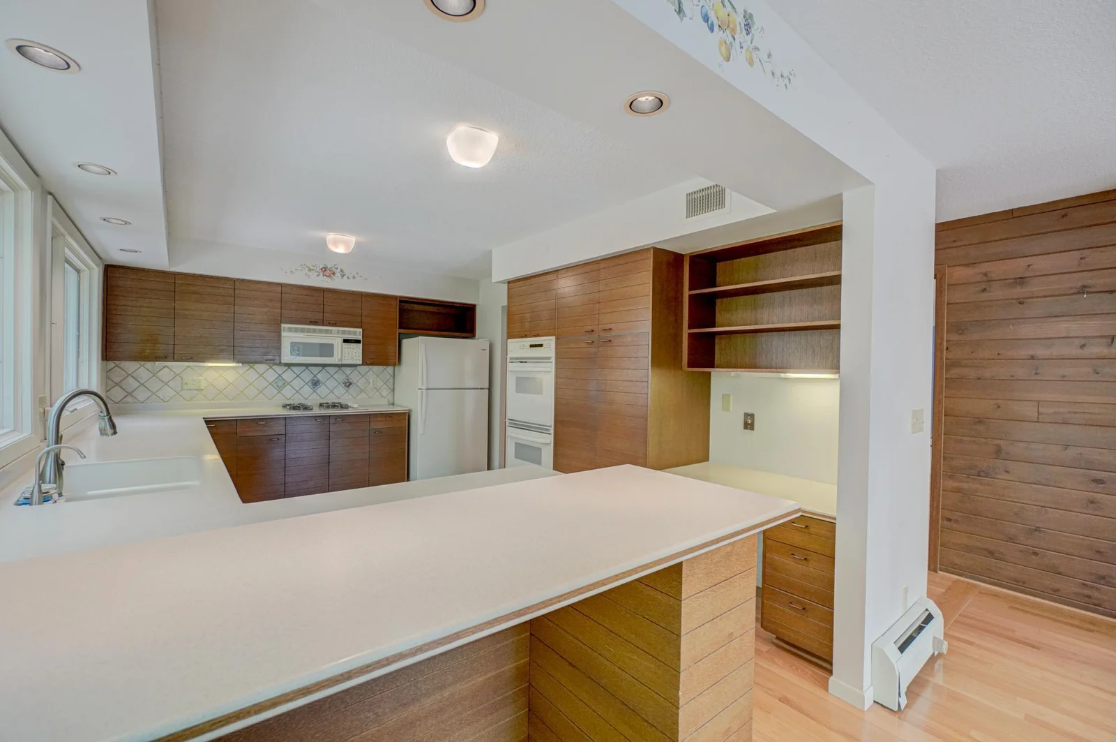 Kitchen features plenty of storage space and counter space.