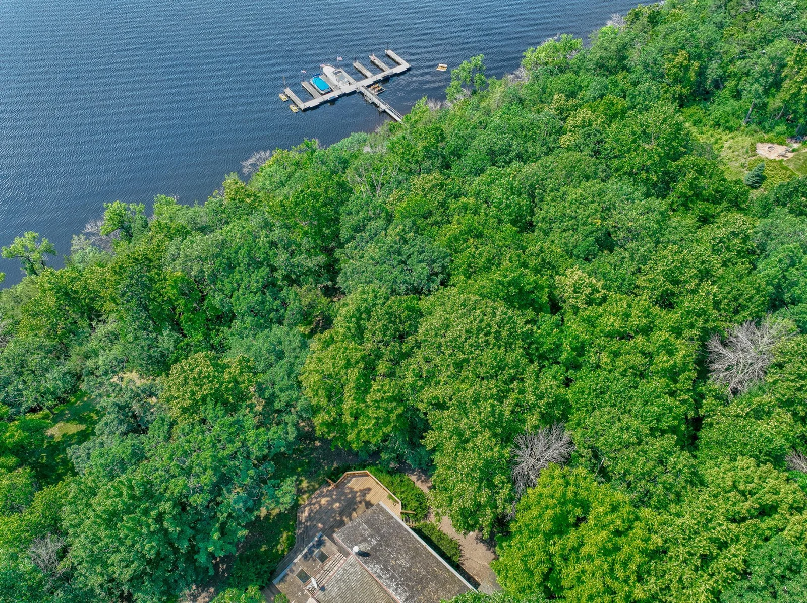 Set on a private, spacious lot surrounded by mature trees, this home offers beautiful views of the St. Croix River.