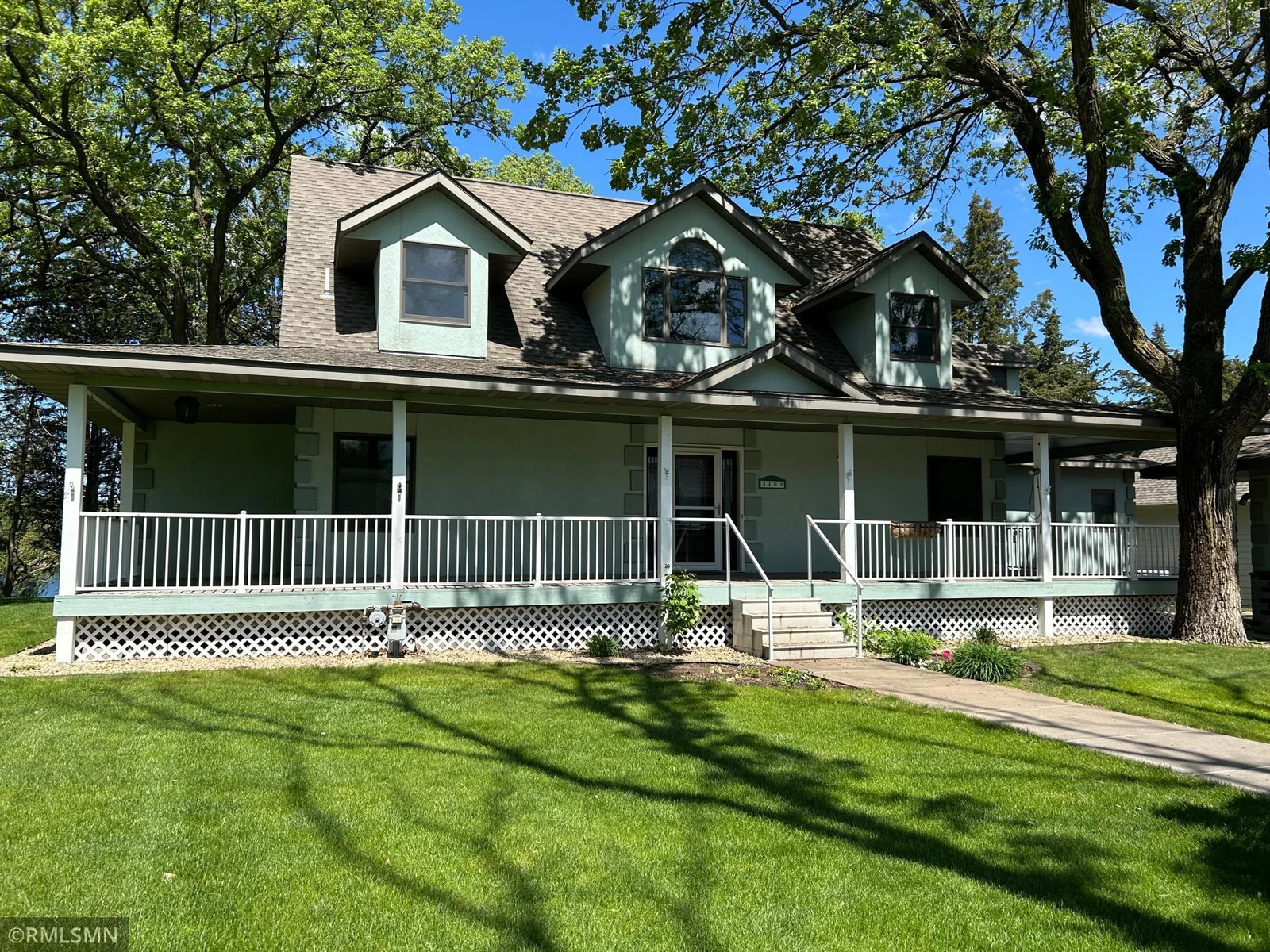 The home has covered wrap around deck in the front of the home to greet you into the home.