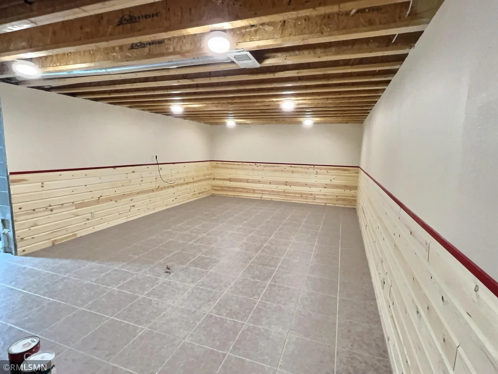 Lower level partially finished recreation room to use use for TV room or exercise room.