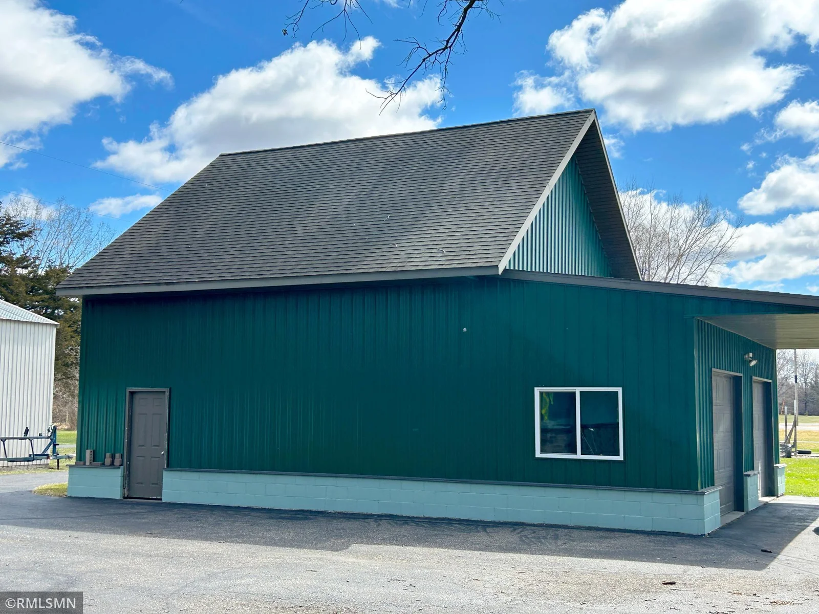 This garage  is also large with an upper level for mor storage.