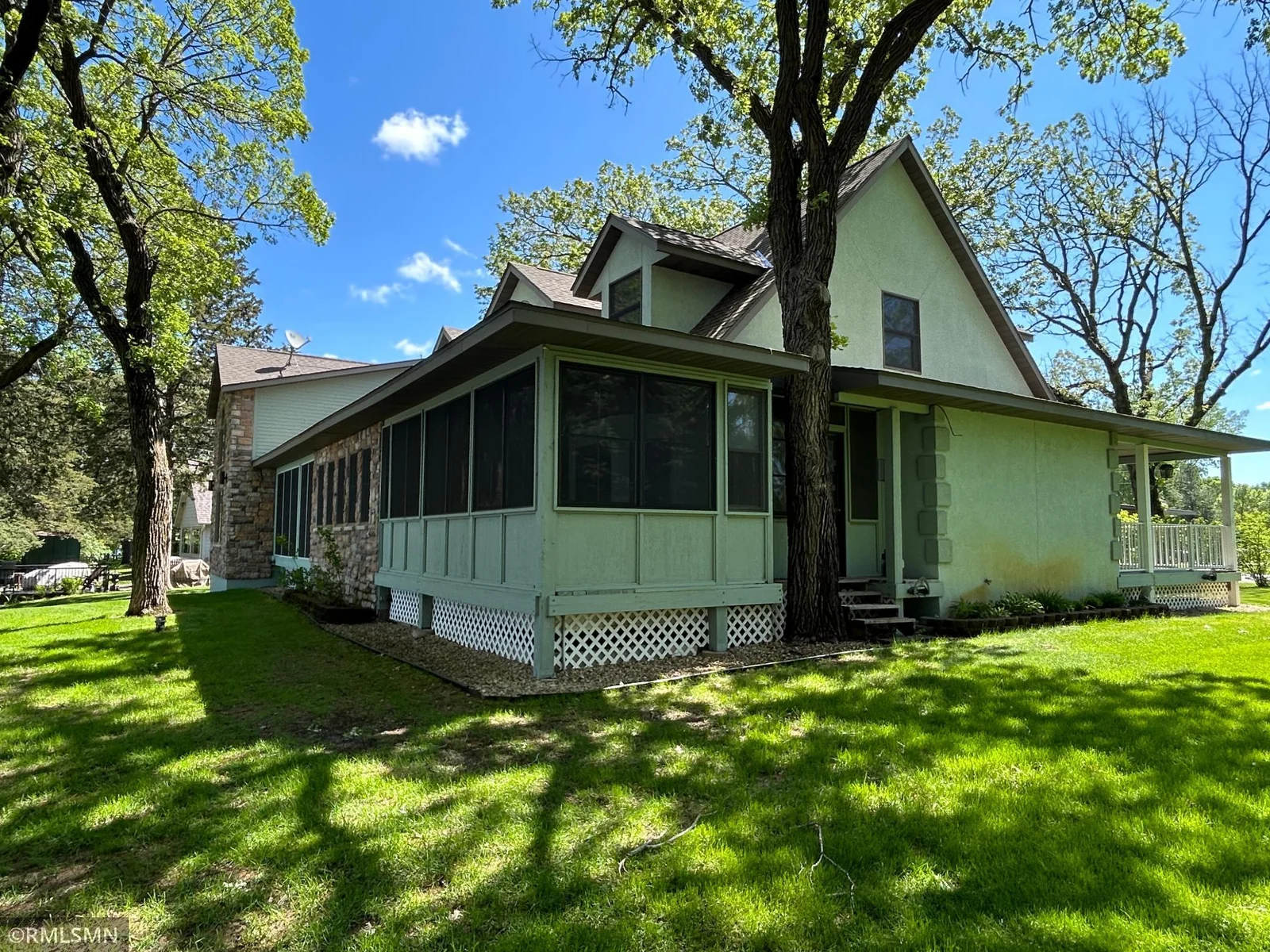 The lakeside screened in porches and sunroom.