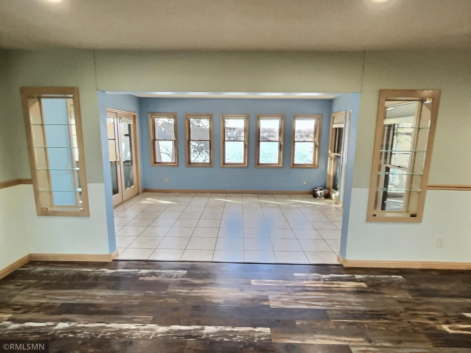 This four season sunroom offers great westerly views of the lake with a screened in porch on both sides.