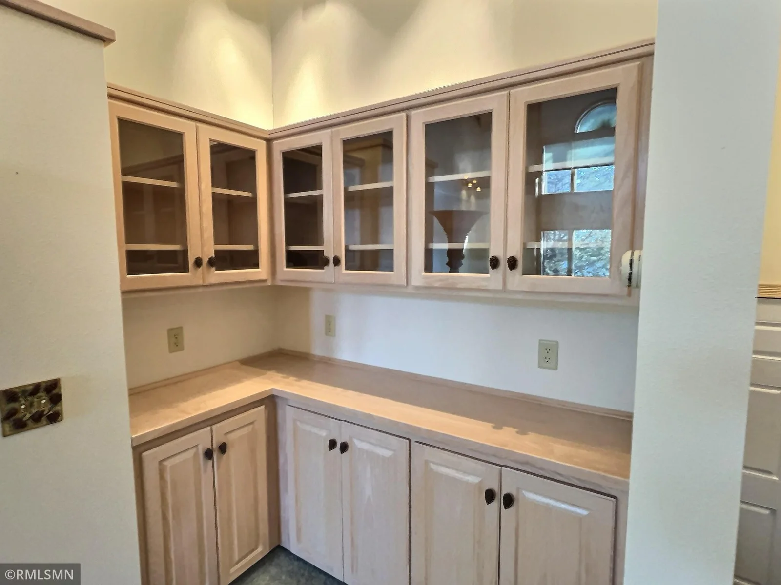 Back bar that offer additional cupboard space for entertaining in formal living room.