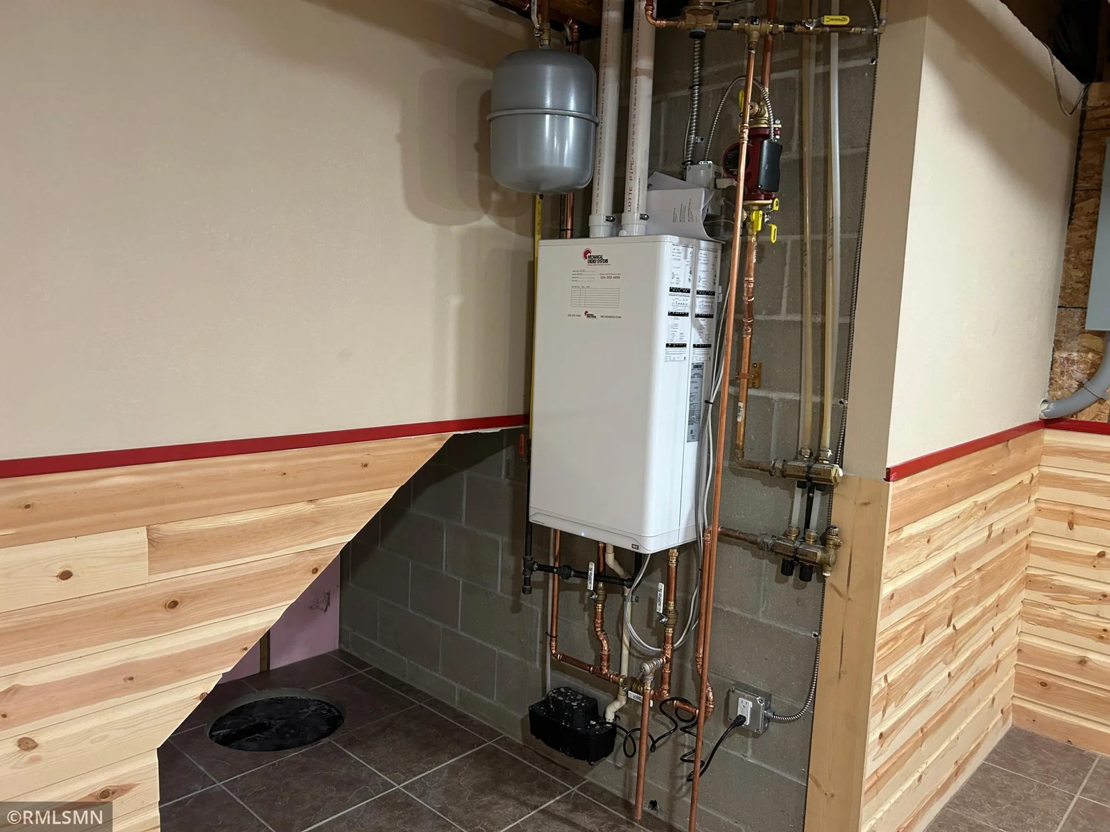 New boiler for the in-floor heat which supplies heat to the formal living room.