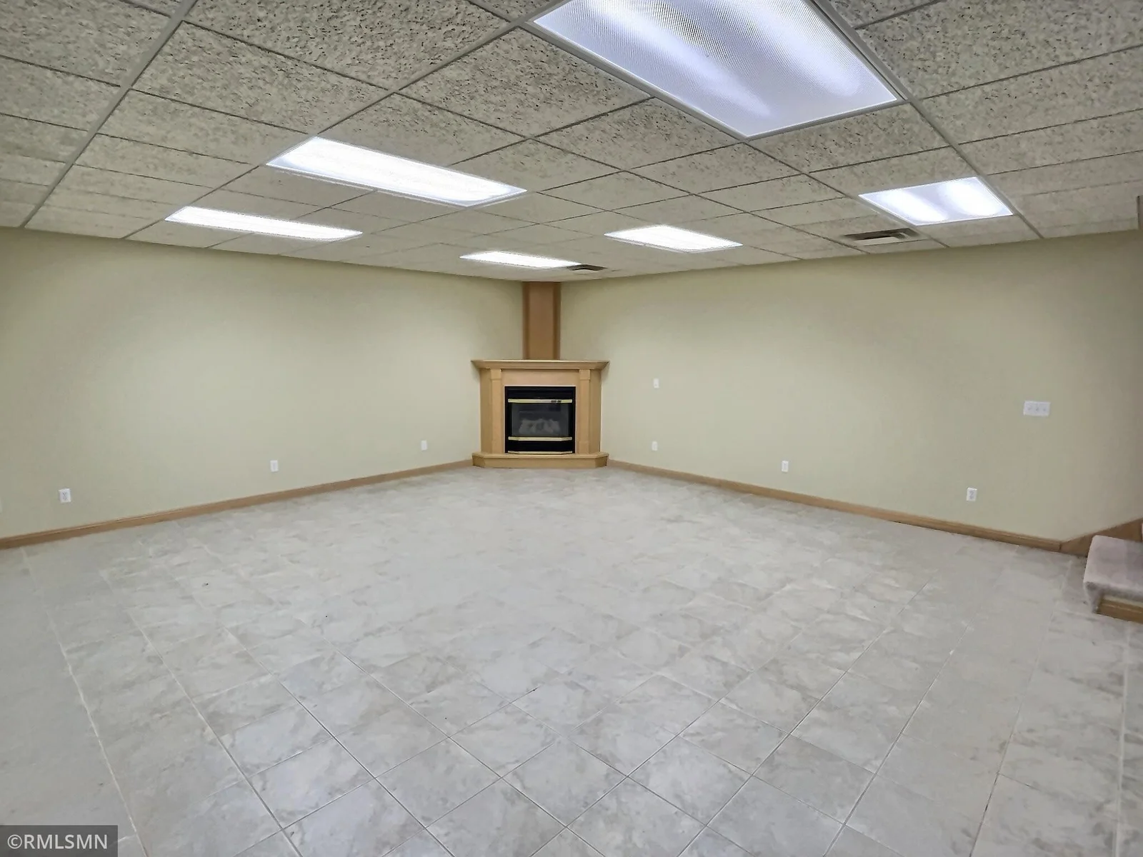 Lower level family room with fireplace.  Many options for uses in this large space.