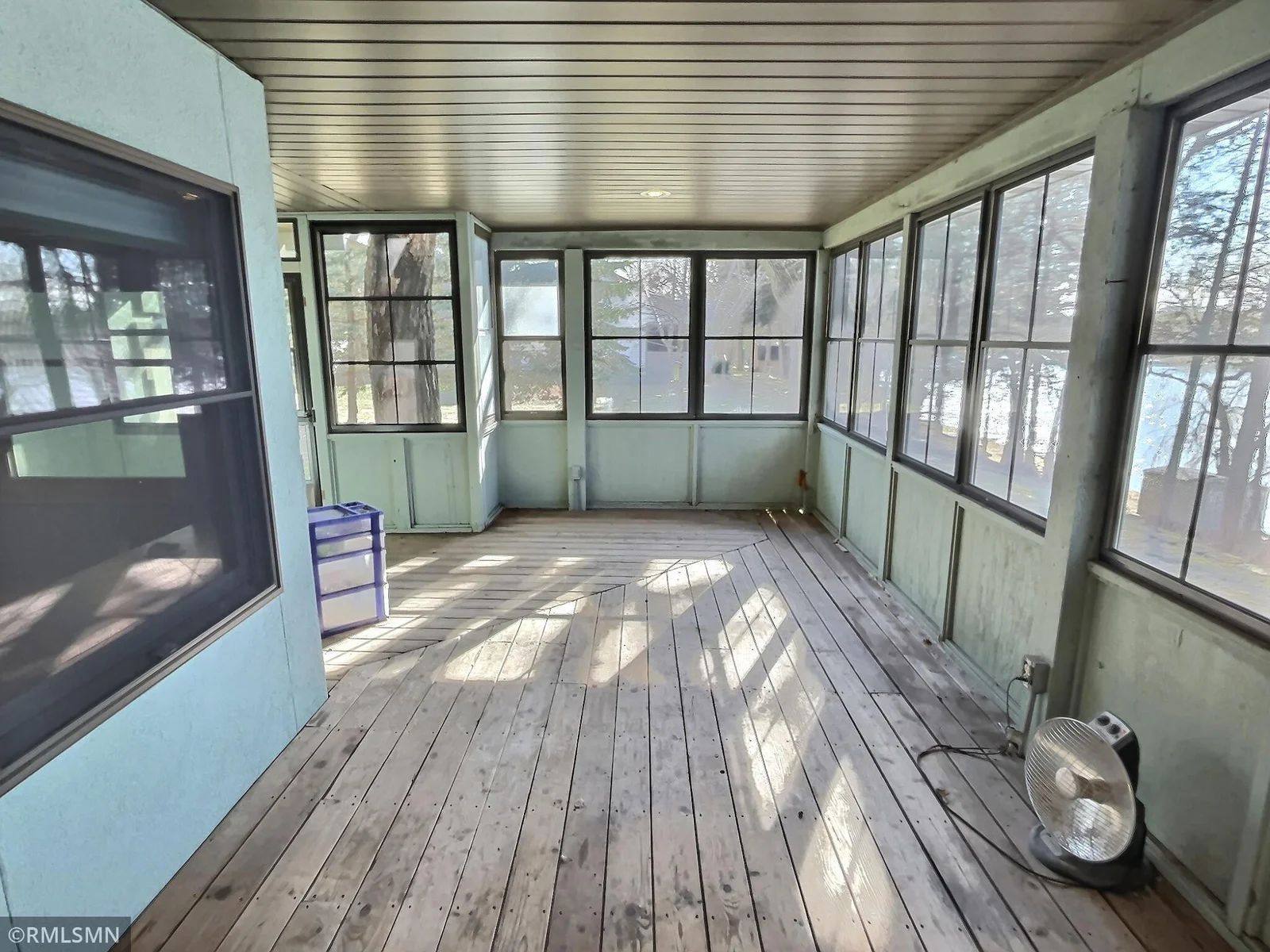 On the other side of the sunroom is the second screened in porch waiting for your imagination. This porch also is screened in with retractable vinyl windows.