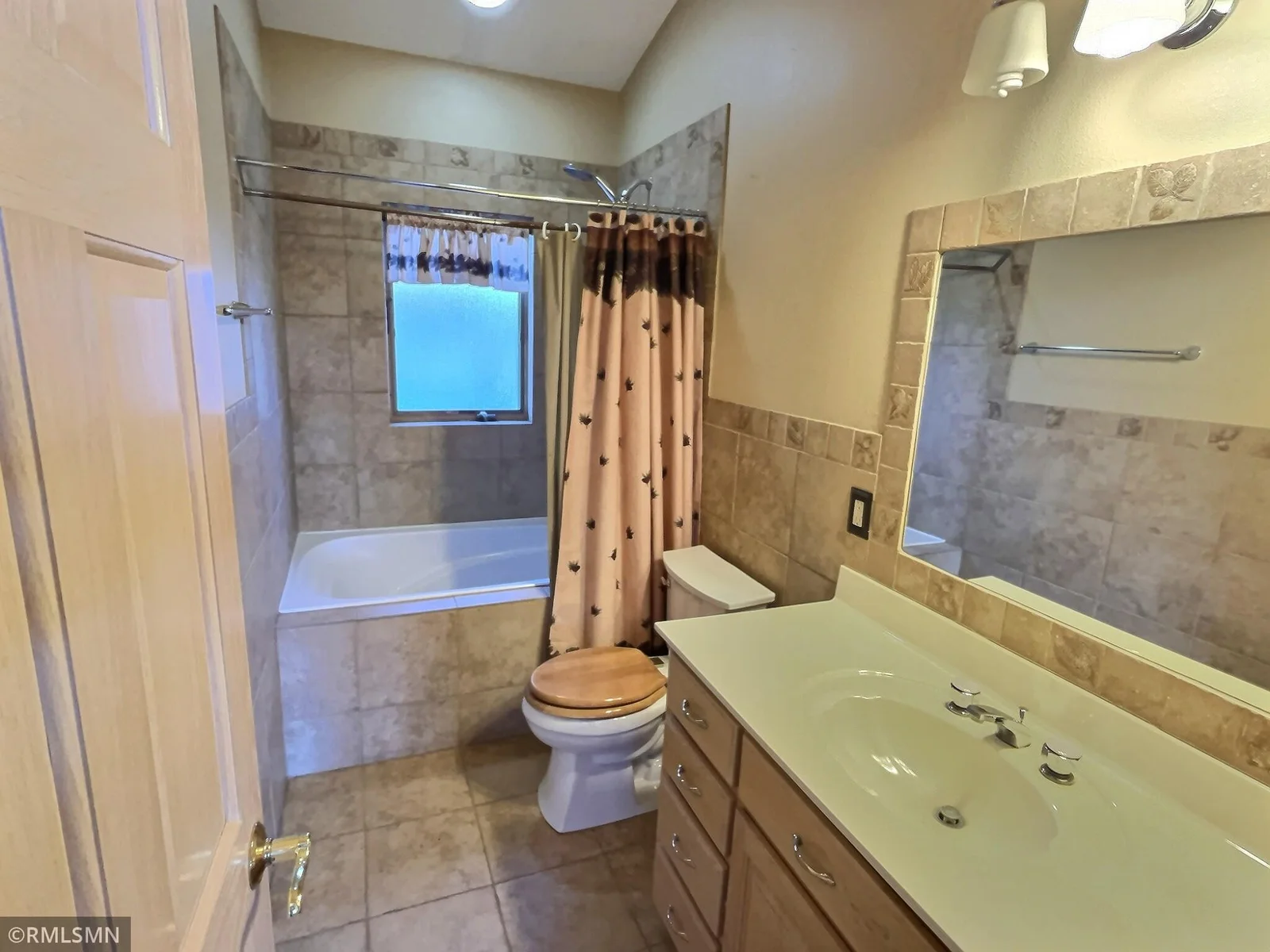 Here is the full bath located off the formal dining room on the main level.