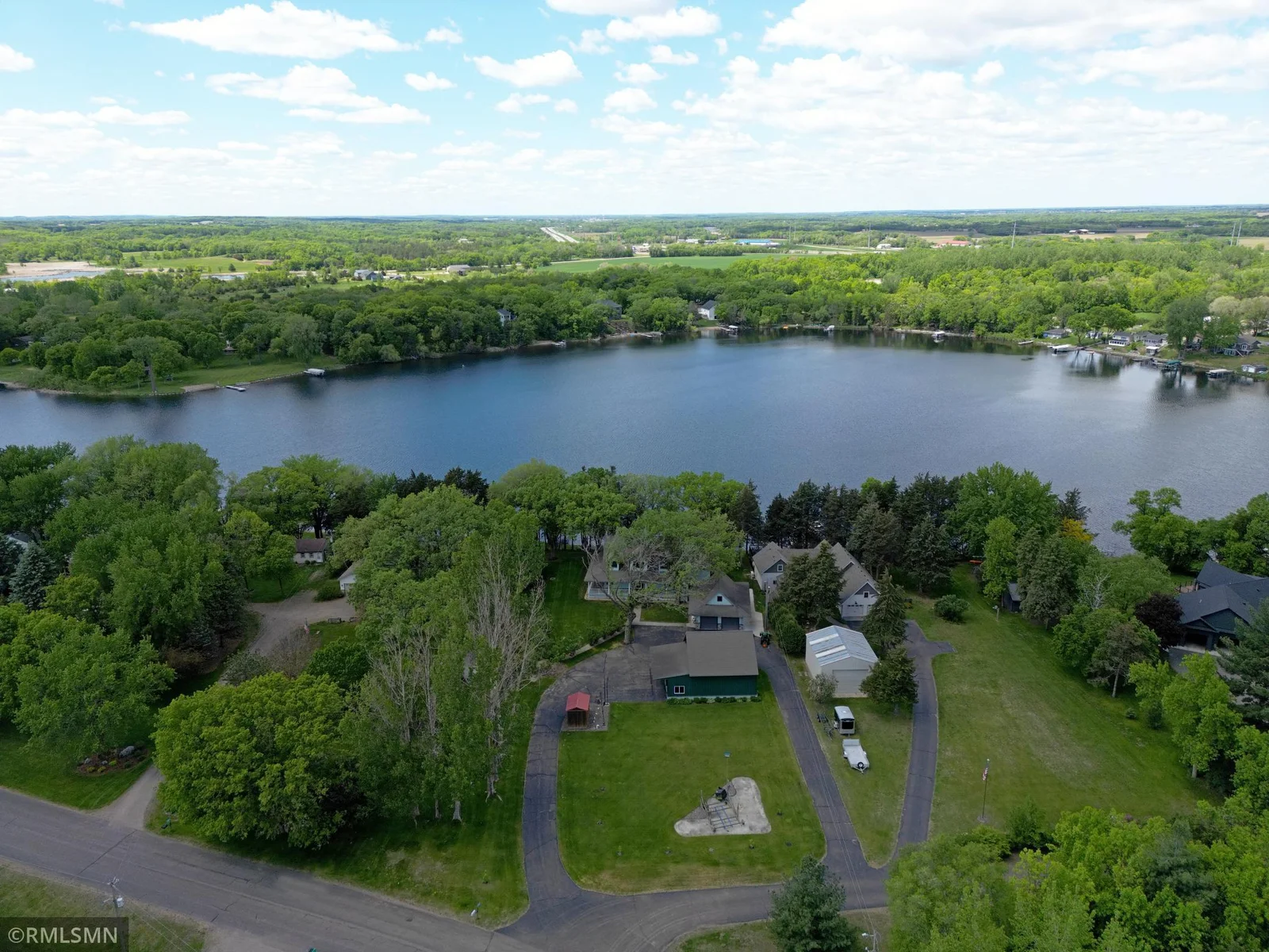 Enjoy the beauty of this west facing one acre property on the shores of Locke Lake.
