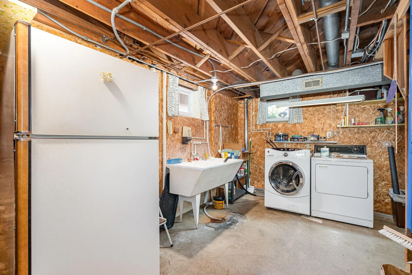 Extra refrigerator and nice laundry area