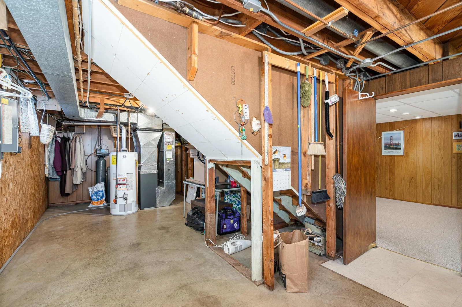 Clean and tidy basement with newer mechanicals