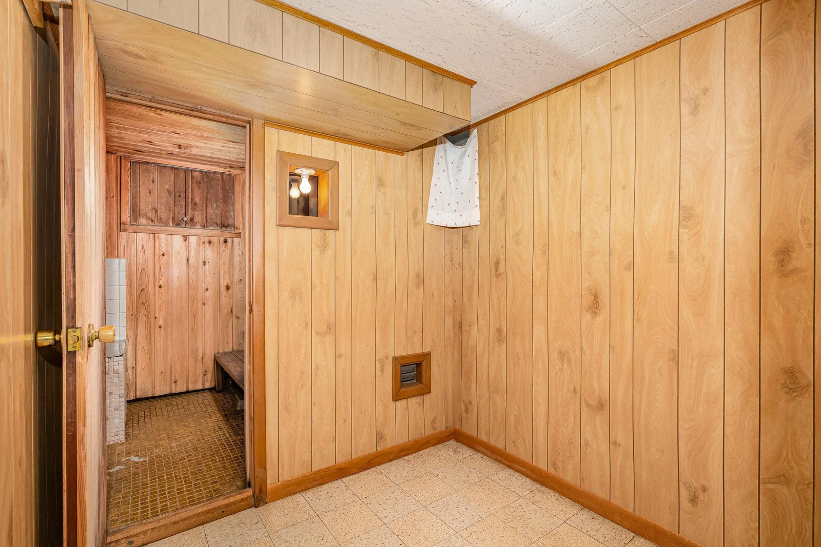 Storage/dressing area leading to sauna