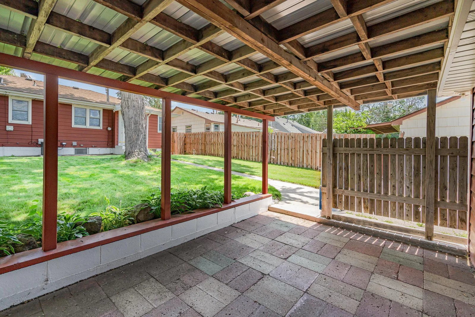 large, covered patio attached to garage