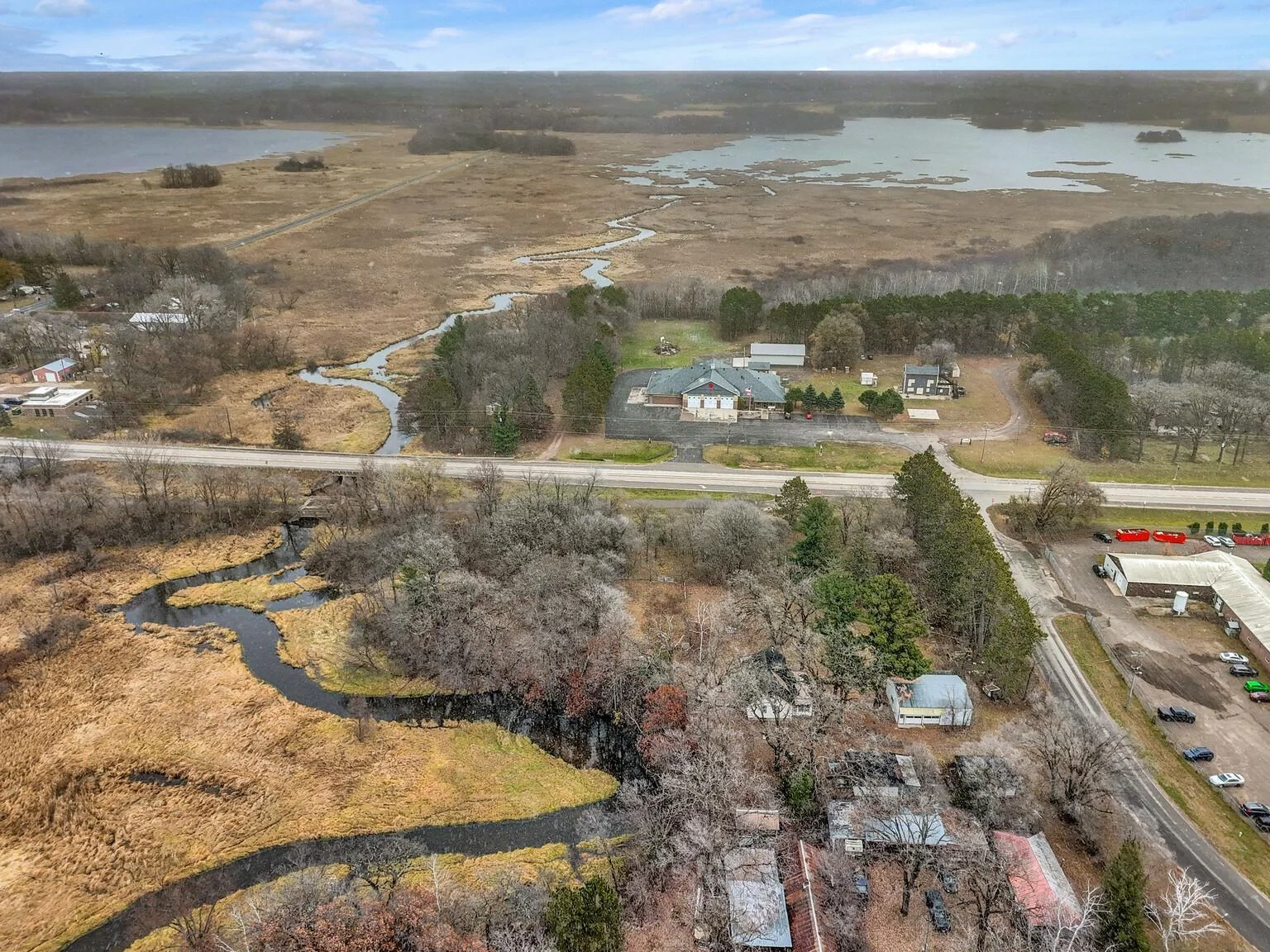 View from the west facing east with river flowing through north side of the property.